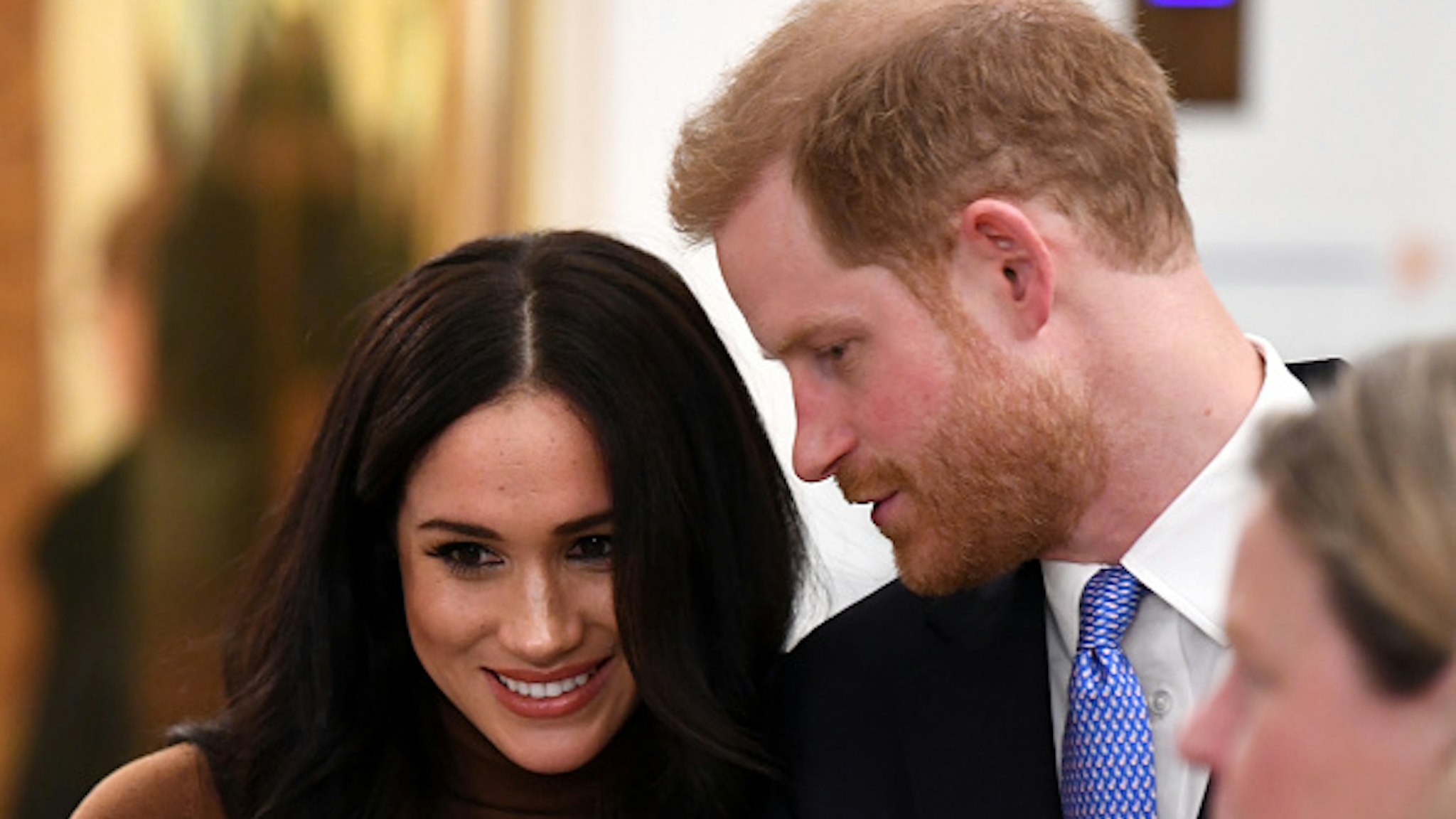 Britain's Prince Harry, Duke of Sussex and Meghan, Duchess of Sussex react during their visit to Canada House in thanks for the warm Canadian hospitality and support they received during their recent stay in Canada, in London on January 7, 2020.