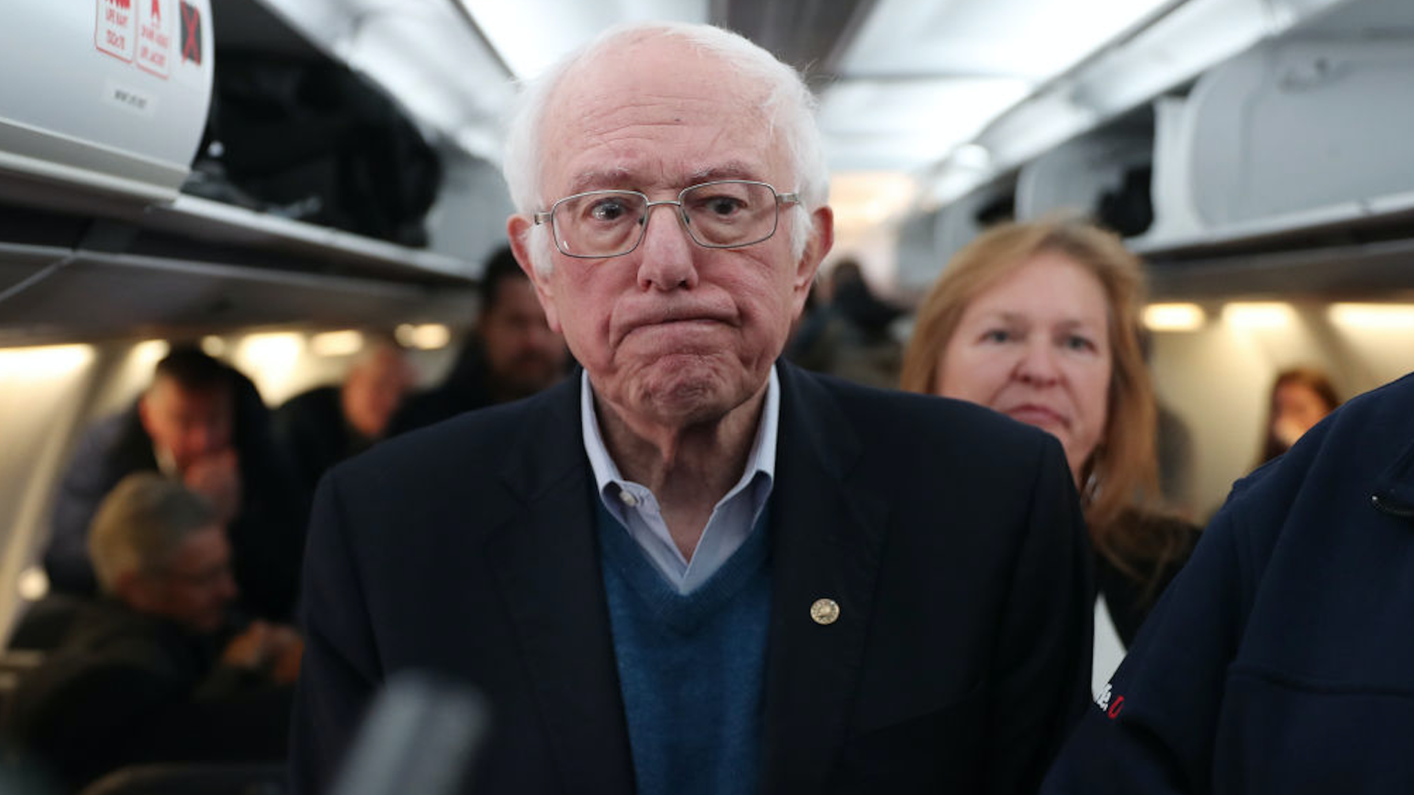 Democratic presidential candidate Sen. Bernie Sanders (I-VT) speaks to the media after boarding the plane at the Des Moines International Airport on February 04, 2020 in Des Moines, Iowa.