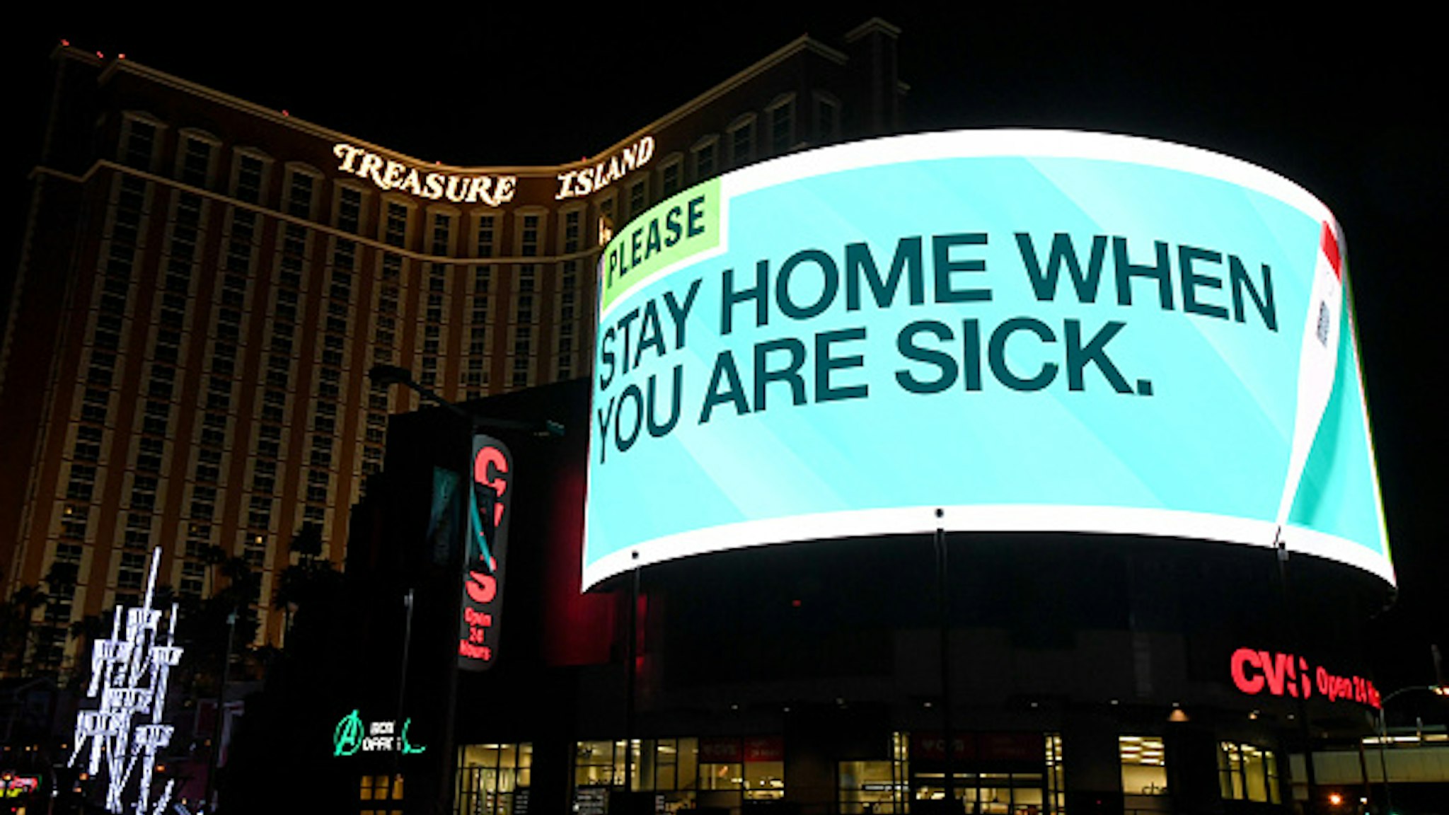 A digital sign above a CVS Pharmacy at the shuttered Treasure Island Hotel &amp; Casino on the Las Vegas Strip displays the message "Please stay home when you are sick" due to the continuing spread of the coronavirus across the United States on March 28, 2020 in Las Vegas, Nevada. On March 20th, Nevada Gov. Steve Sisolak ordered a mandatory shutdown of most nonessential businesses in the state until April 16th to help combat the spread of the virus. The World Health Organization declared the coronavirus (COVID-19) a global pandemic on March 11th.