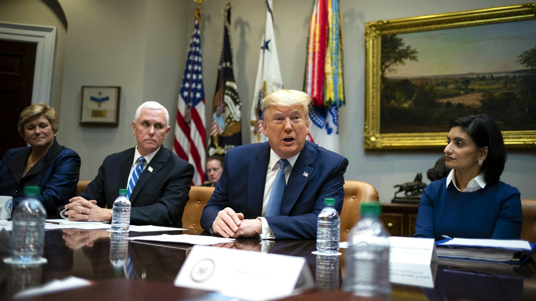 U.S. President Donald Trump, center, speaks while Gail Boudreaux, president and chief executive officer of Anthem Inc., from left, Vice President Mike Pence, and Seema Verma, administrator of the Centers for Medicare and Medicaid Services, listen during a coronavirus briefing with health insurers in the Roosevelt Room of the White House in Washington, D.C., U.S., on Tuesday, March 10, 2020. The window for fully containing the coronavirus has passed in some parts of the U.S. and the White House will roll out plans later Tuesday to mitigate its impact.