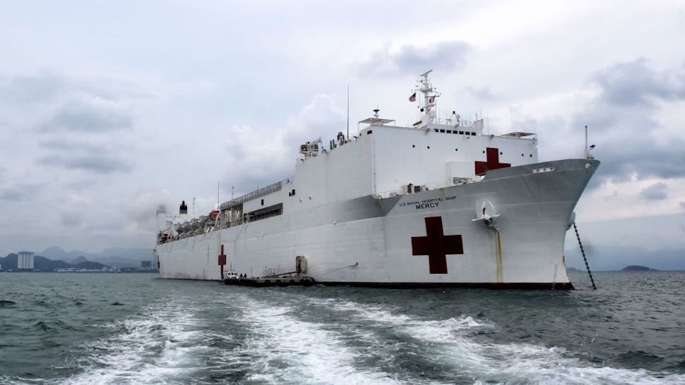 USNS Mercy US Navy hospital ship USNS Mercy arrives in Nha Trang in central Vietnam on May 17, 2018 as part of a two-week Pacific Partnership mission involving multilateral humanitarian assistance and disaster relief preparedness aimed at boosting security ties between the former war foes. (Photo by Linh PHAM / AFP)