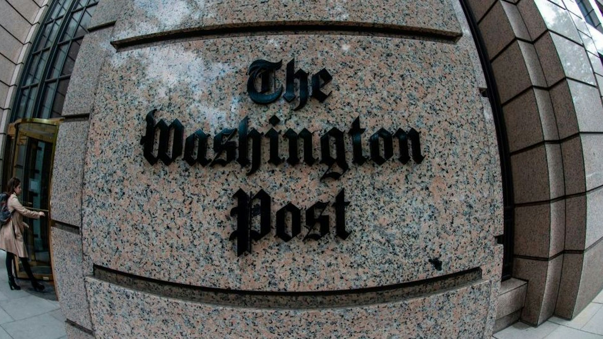 The building of the Washington Post newspaper headquarter is seen on K Street in Washington DC on May 16, 2019. - The Washington Post is a major American daily newspaper published in Washington, D.C., with a particular emphasis on national politics and the federal government. It has the largest circulation in the Washington metropolitan area. (Photo by Eric BARADAT / AFP)
