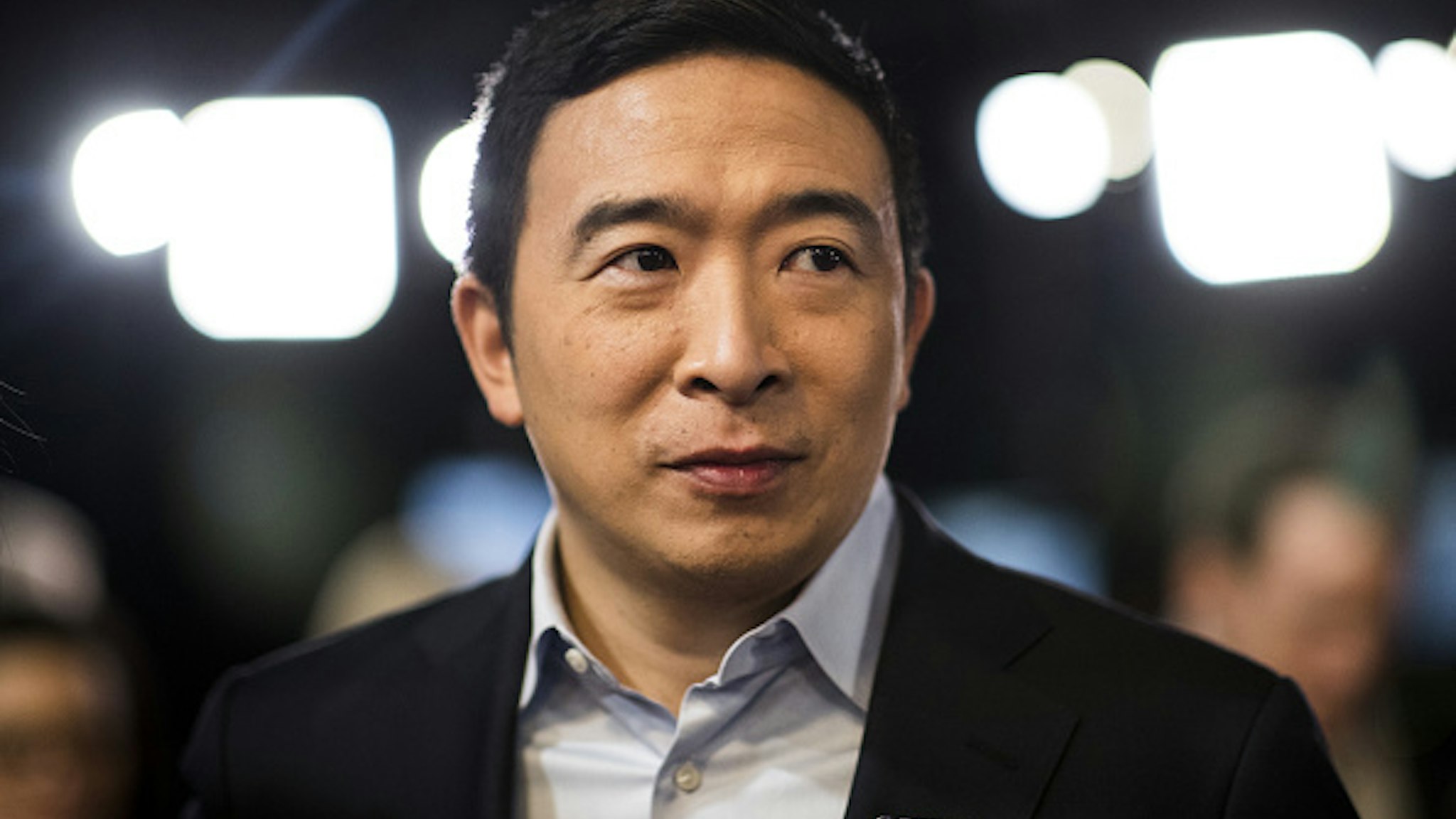 Andrew Yang, founder of Venture for America and 2020 Democratic presidential candidate, stands in the spin room following the Democratic presidential debate at Saint Anselm College in Manchester, New Hampshire, U.S., on Friday, Feb. 7, 2020. The New Hampshire debates often mark a turning point in a presidential campaign, as the field of candidates is winnowed and voters begin to pay closer attention.