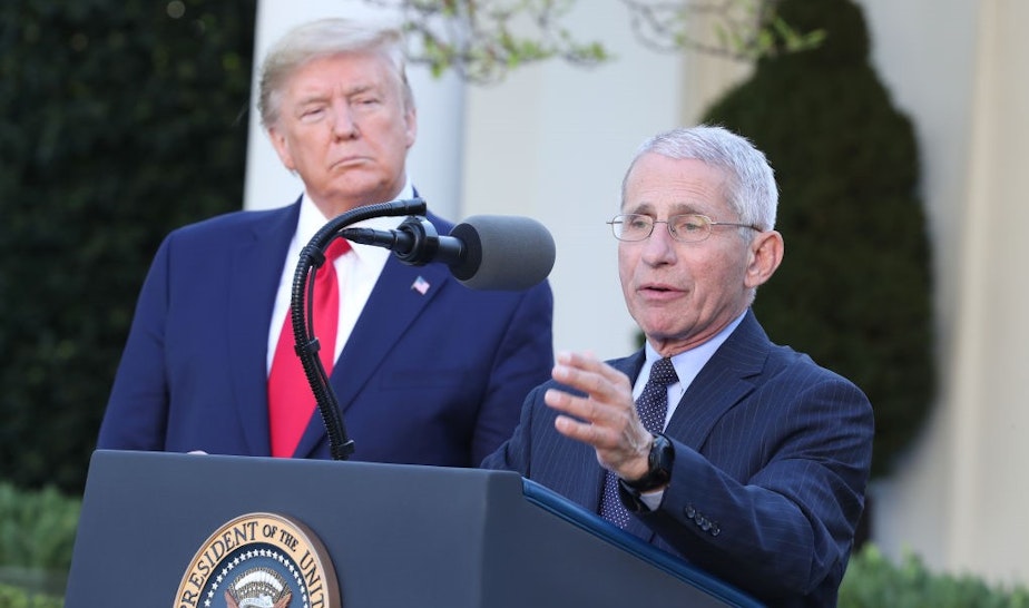 Anthony Fauci, director of the National Institute of Allergy and Infectious Diseases, right, speaks as U.S. President Donald Trump listens during a Coronavirus Task Force news conference in the Rose Garden of the White House in Washington, D.C., U.S., on Monday, March 30, 2020. Trump said he would now extend social distancing measures until at least April 30. Photographer