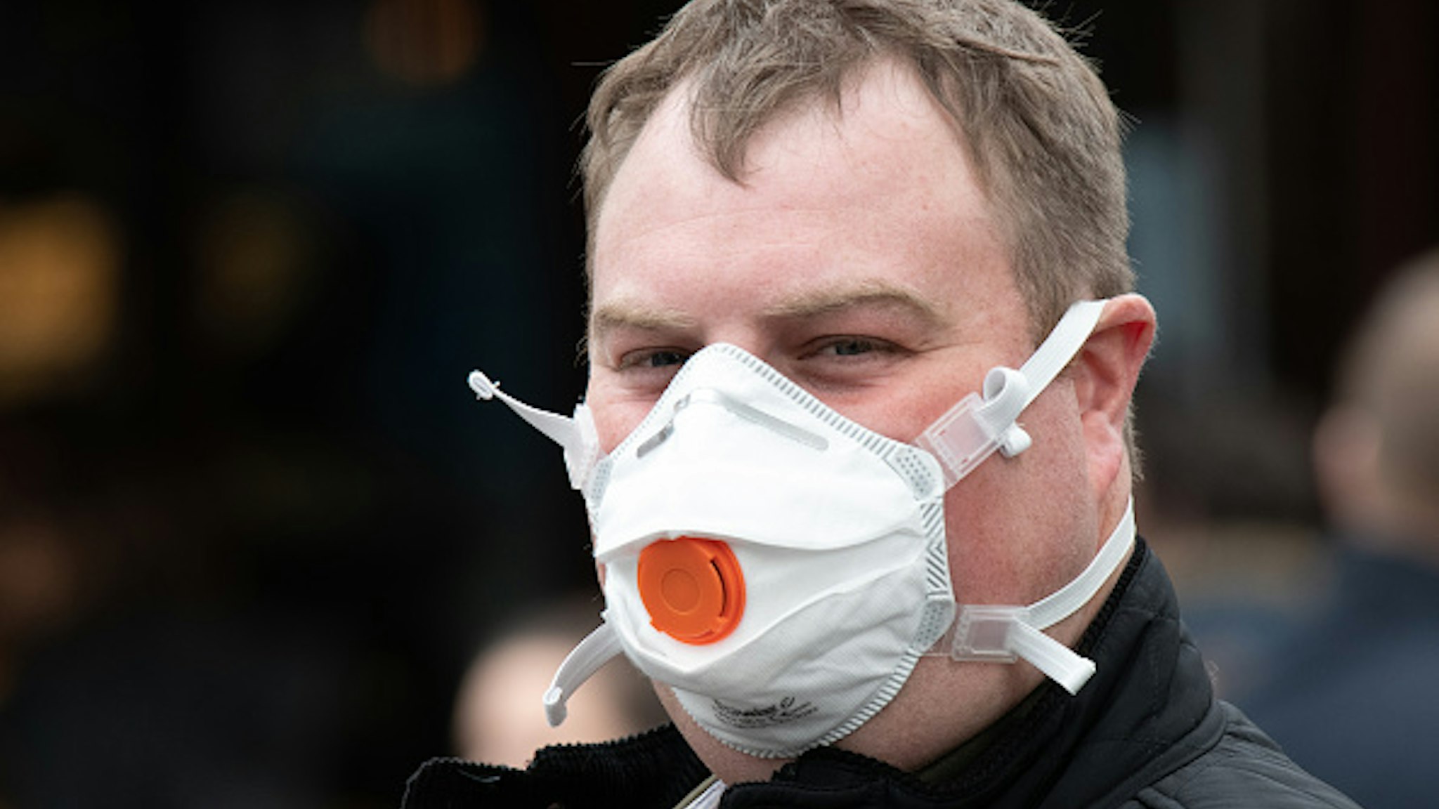 CARDIFF, UNITED KINGDOM - MARCH 14: A man wears a N95 protective respirator mask on March 14, 2020 in Cardiff, United Kingdom.