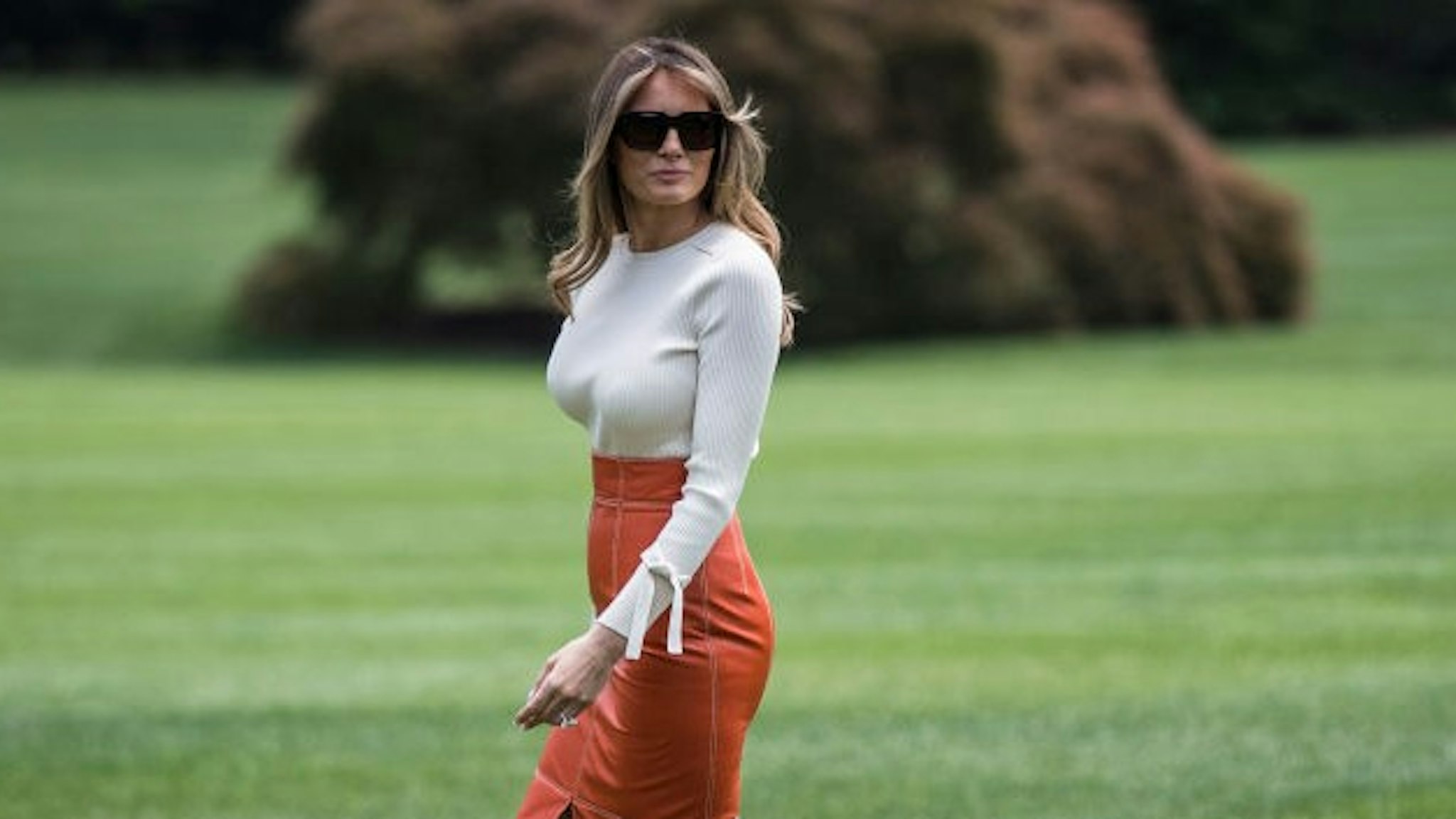WASHINGTON, DC - MAY 19: President Donald Trump and first lady Melania Trump walk across the South Lawn to board Marine One and fly to Andrews Air Force Base, Md., at the White House in Washington, DC on Friday, May 19, 2017. Trump is leaving for his first foreign trip, visiting Saudi Arabia, Israel, Vatican, and a pair of summits in Brussels and Sicily. (Photo by
