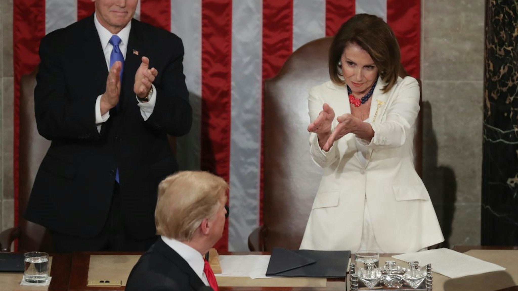 WASHINGTON, DC - FEBRUARY 05: Vice President Mike Pence and Speaker Nancy Pelosi greet President Donald Trump just ahead of the State of the Union address in the chamber of the U.S. House of Representatives at the U.S. Capitol Building on February 5, 2019 in Washington, DC. President Trump's second State of the Union address was postponed one week due to the partial government shutdown. (Photo by