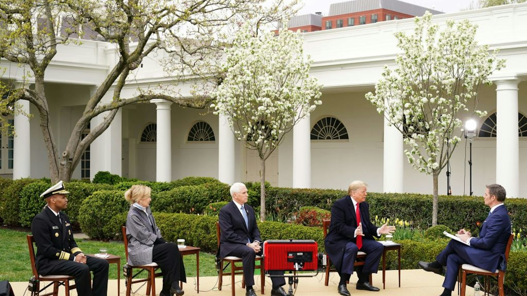 (L-R) US Surgeon General Jerome Adams, Response coordinator for White House Coronavirus Task Force Deborah Birx, US Vice President Mike Pence and President Donald Trump take part in a Fox News virtual town hall meeting with anchor Bill Hemmer, from the Rose Garden of the White House in Washington, DC, on March 24, 2020. (Photo by MANDEL NGAN / AFP) (Photo by