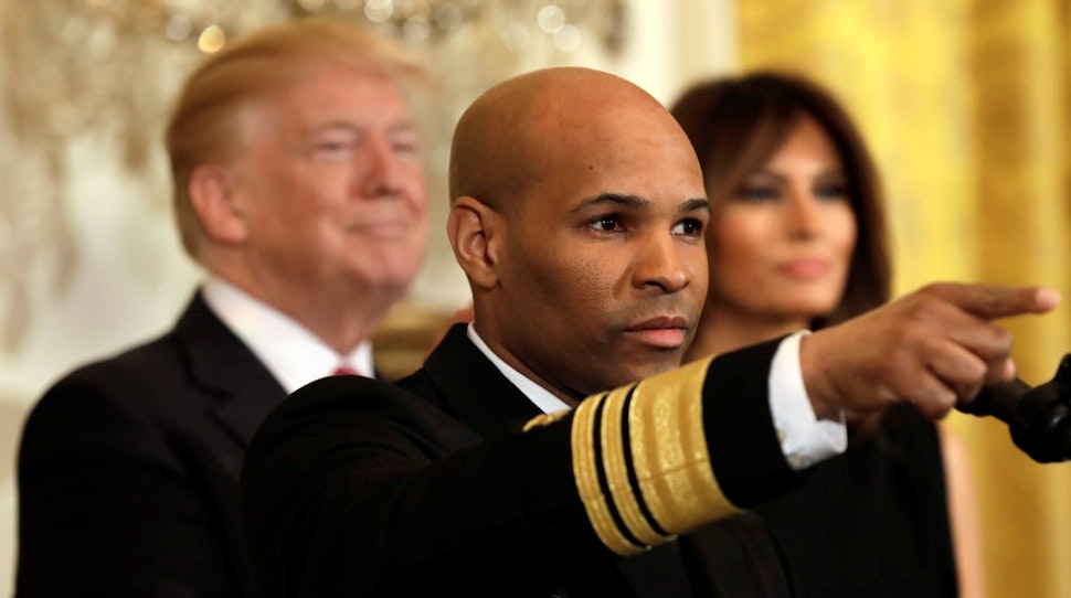 Vice Admiral Jerome Adams, the U.S. Surgeon General, gestures while speaking at an event with U.S. President Donald Trump and First Lady Melania Trump during a National African American History Month reception in Washington, D.C., U.S., on Tuesday, Feb. 13, 2018. U.S. President Donald Trump's move to end a program protecting hundreds of thousands of children of undocumented immigrants from deportation was blocked by a federal judge in New York. Its the second time in less than two months that a U.S. judge found the rescinding of the program as proposed would be wrong. Photographer: