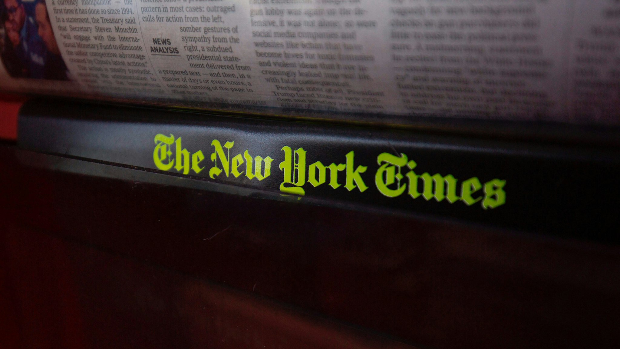The New York Times logo is seen on a newspaper rack at a convenience store in Washington, DC, on August 6, 2019.