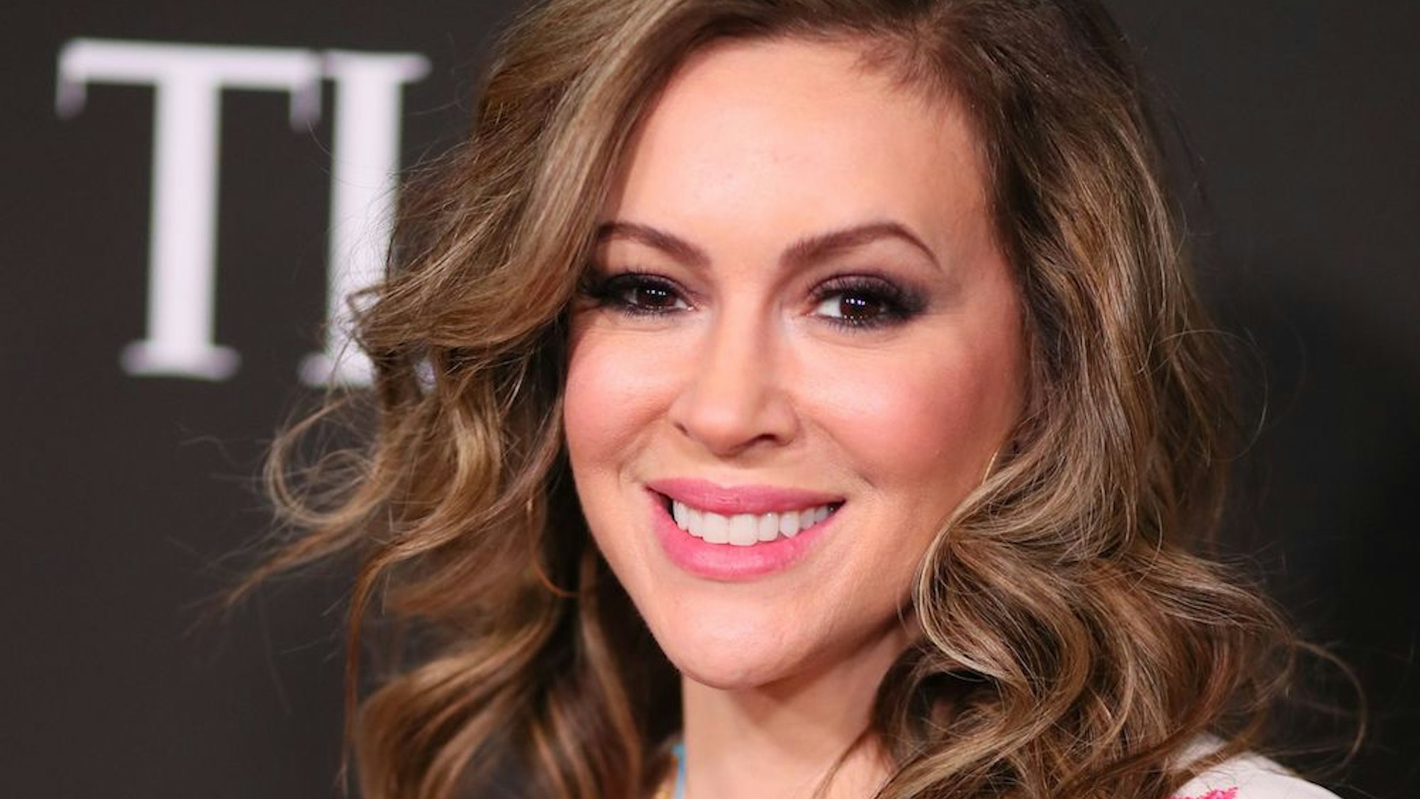 Actress Alyssa Milano arrives for the 10th Anniversary CORE (Community Organized Relief Effort) Gala at the Wiltern theatre in Los Angeles on January 15, 2020. - CORE (formerly known as J/P HRO) is marking the 10th anniversary of both the devastating 2010 Haitian earthquake and the subsequent founding of this organization by Sean Penn. (Photo by Jean-Baptiste LACROIX / AFP