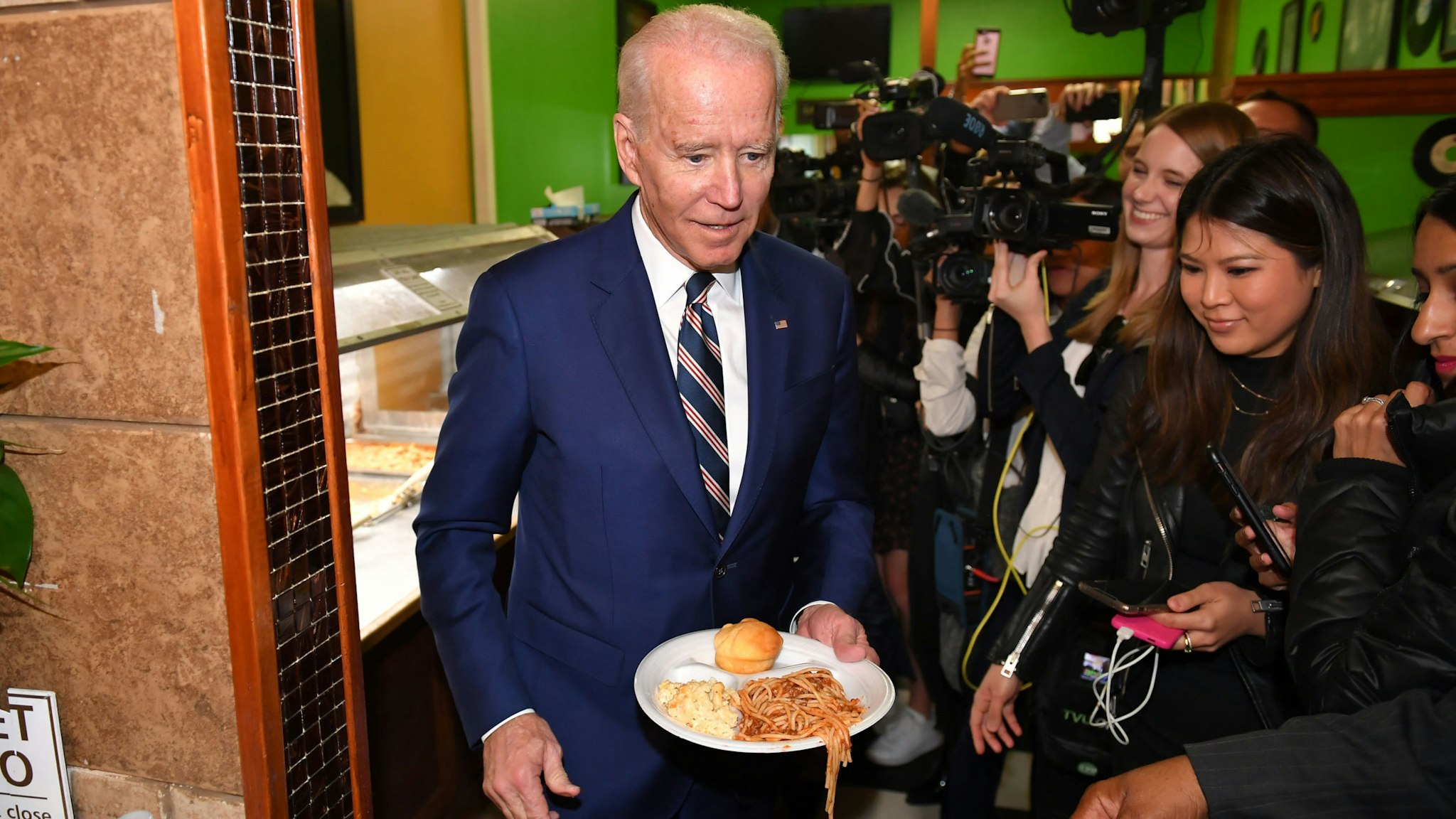 Democratic presidential candidate Joe Biden picks up some lunch at Pearl's Southern Cooking restaurant in Jackson, Mississippi on March 8, 2020.