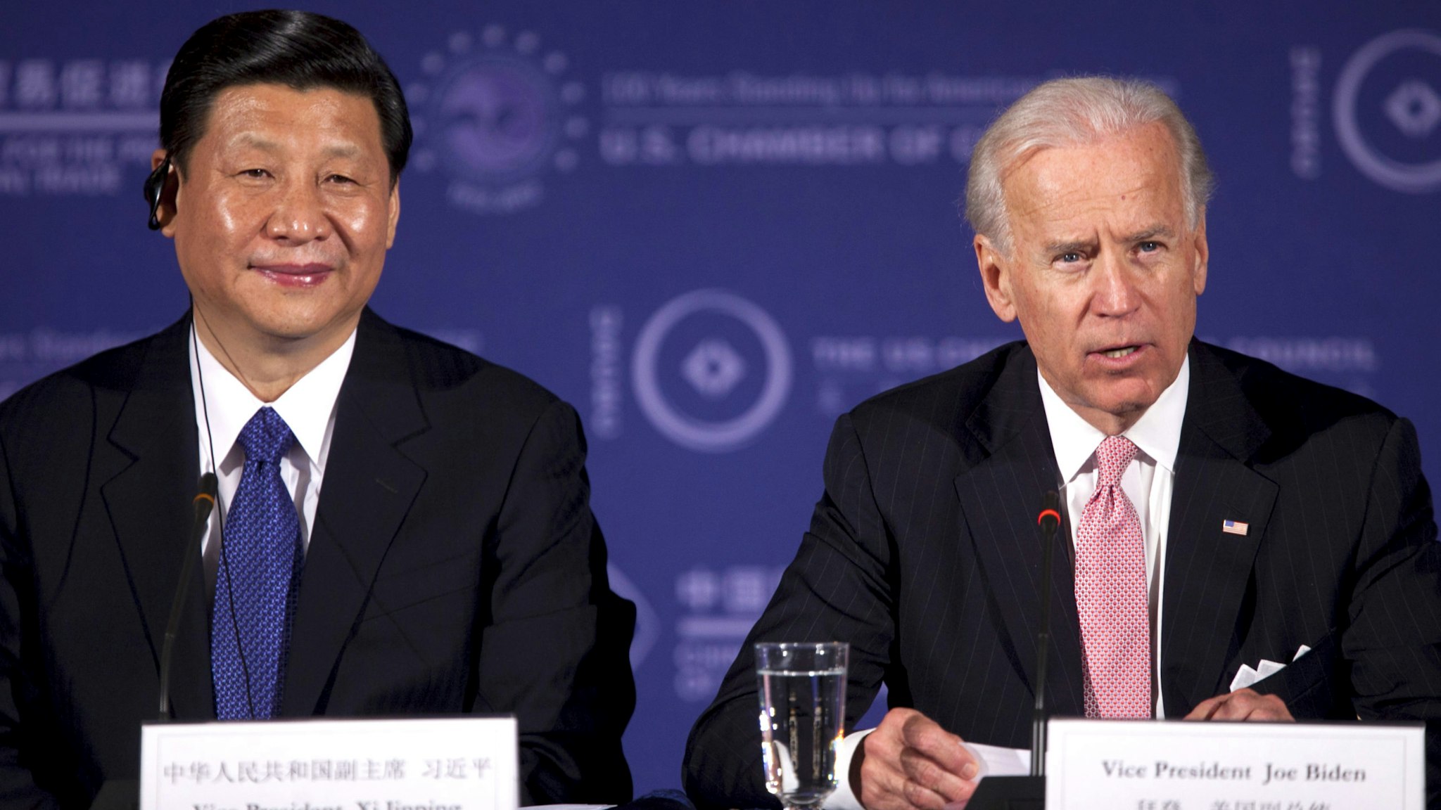 Xi Jinping, vice president of China, left, listens as U.S. Vice President Joe Biden speaks during the U.S.-China Business Roundtable at the Chamber of Commerce in Washington, D.C., U.S., on Tuesday, Feb. 14, 2012. President Barack Obama told Chinese Vice President Xi Jinping that China's growing economic power brings with it responsibility to work toward "balanced" trade and to recognize the aspirations of all people for greater rights.