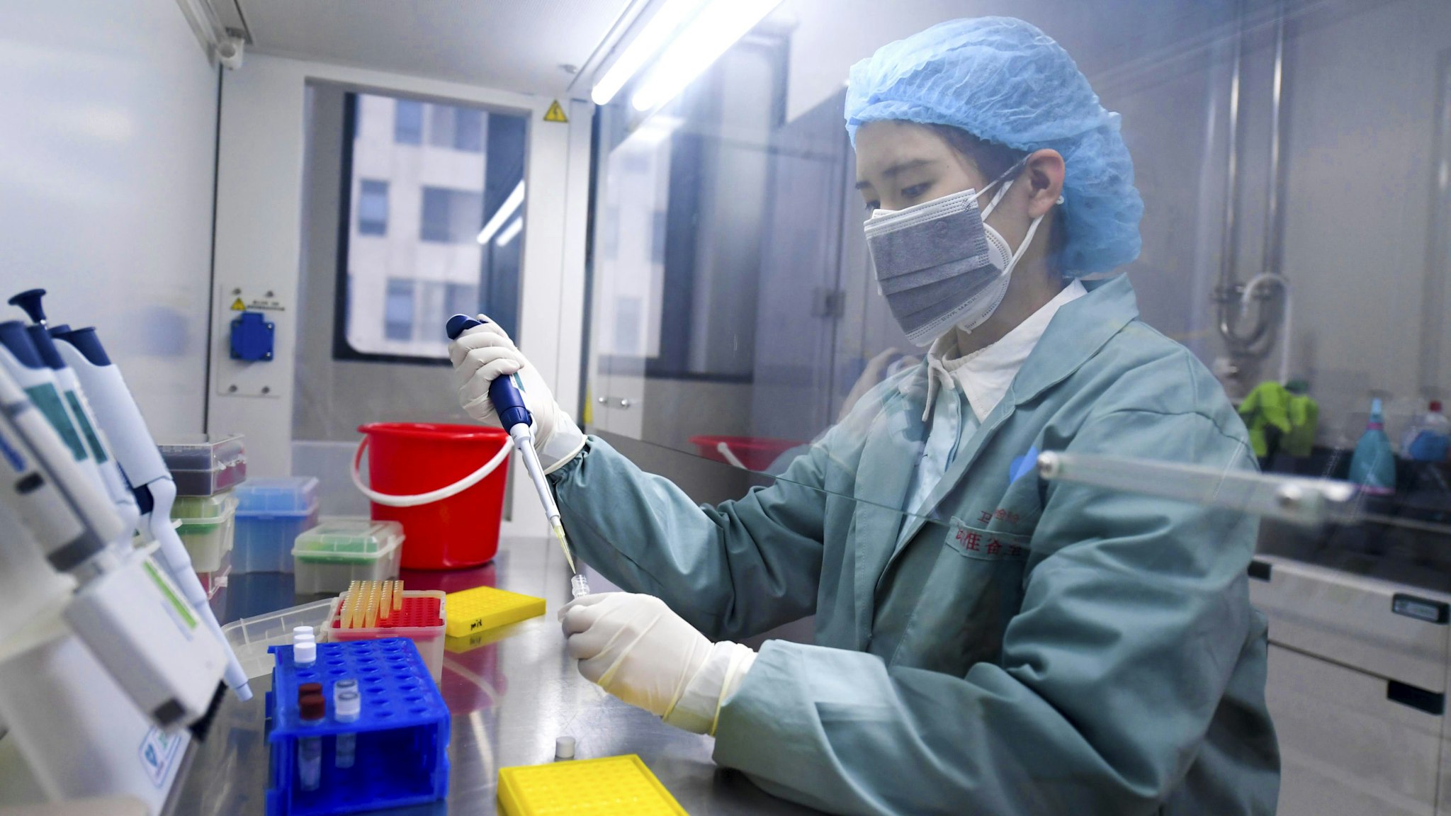 CHANGSHA, CHINA - MARCH 04: A medical worker prepares reagent during nucleic acid test at Weishi Medical Laboratory on March 4, 2020 in Changsha, Hunan Province of China.