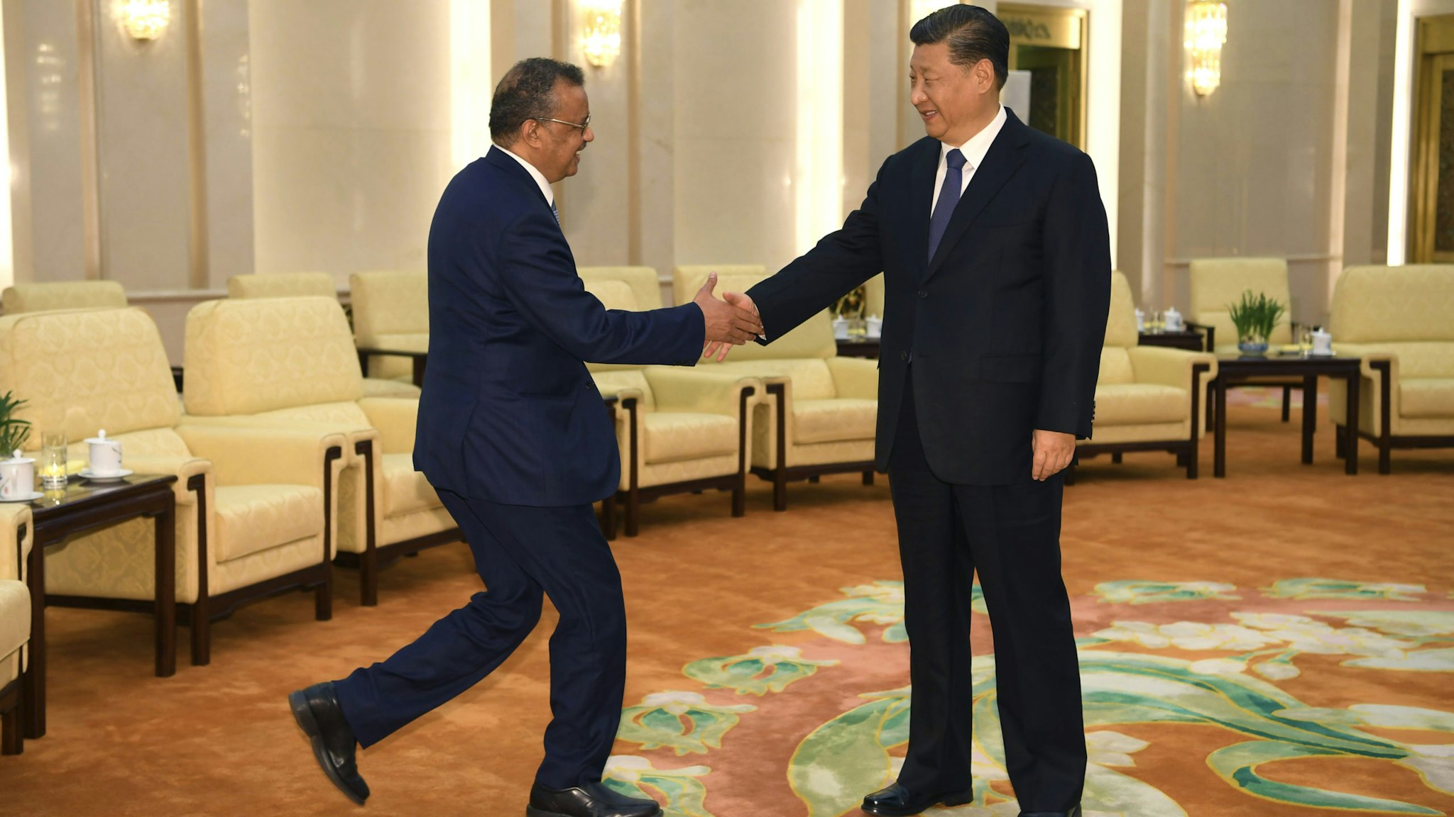BEIJING, CHINA - JANUARY 28: Tedros Adhanom, Director General of the World Health Organization, (L) shakes hands with Chinese President Xi Jinping before a meeting at the Great Hall of the People, on January 28, 2020 in Beijing, China.