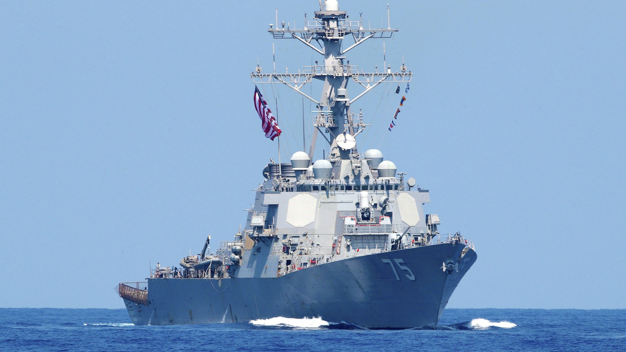 A photo taken on August 7, 2019, shows the US Navy USS Donald Cook class guided missile destroyer during an exercise how simulate a humanitarian response to a powerful earthquake and significant movement of IDF vessels and foreign vessels in the Mediterranean sea. - Sailors from France, Greece and the United States arrived on their vessels and were joined by the Israelis off the Israeli port city of Haifa for a four-day exercise, called "Mighty Waves". It simulated extracting wounded civilians to sea for treatment, fishing people out of the water and transferring humanitarian aid, with representatives of seven other navies taking part as observers.