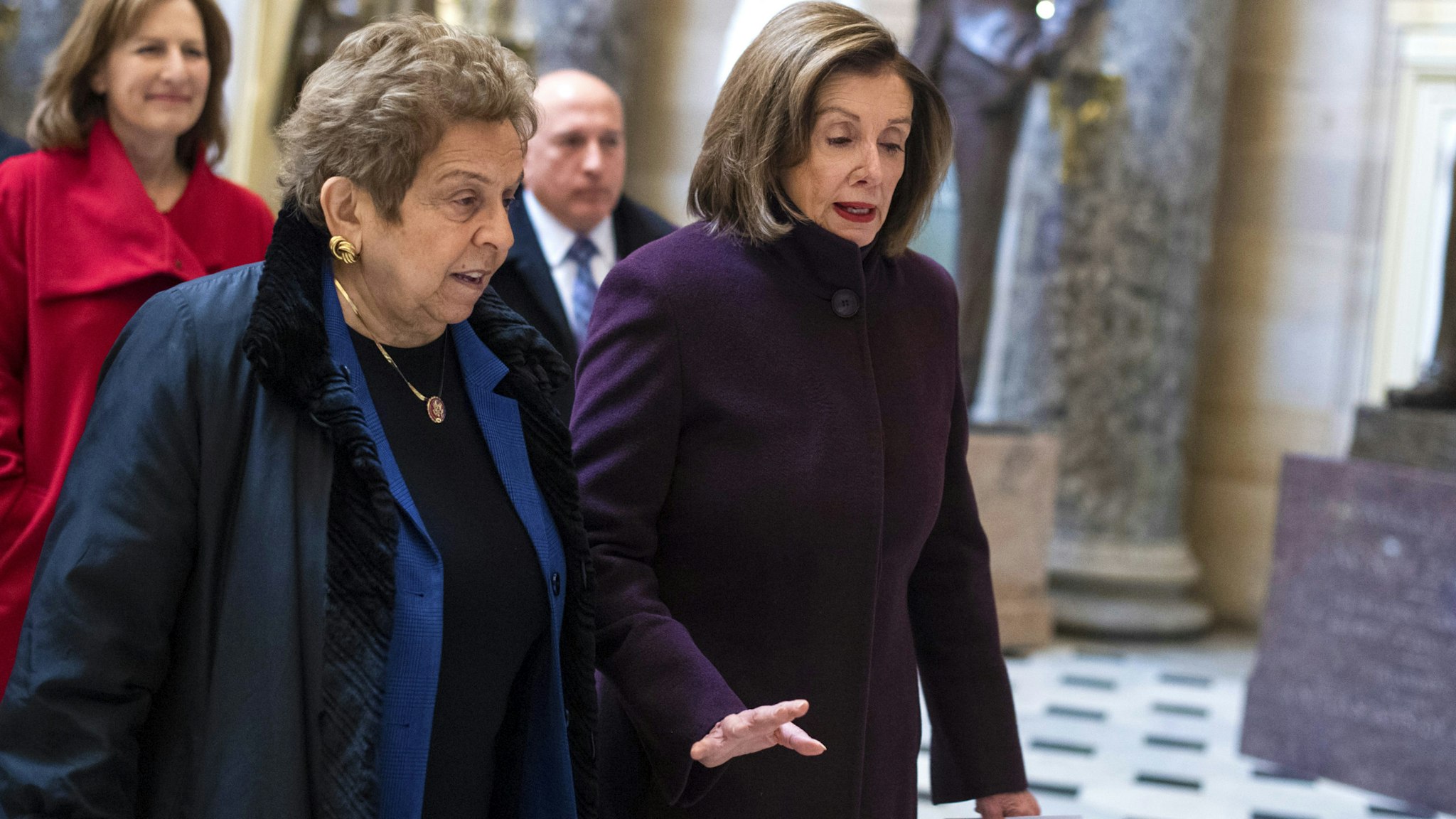 UNITED STATES - DECEMBER 12: Speaker of the House Nancy Pelosi, D-Calif., right, and Rep. Donna Shalala, D-Fla., are seen in the Capitols Statuary Hall before a rally on the Lower Drug Costs Now Act, on Thursday, December 12, 2019.