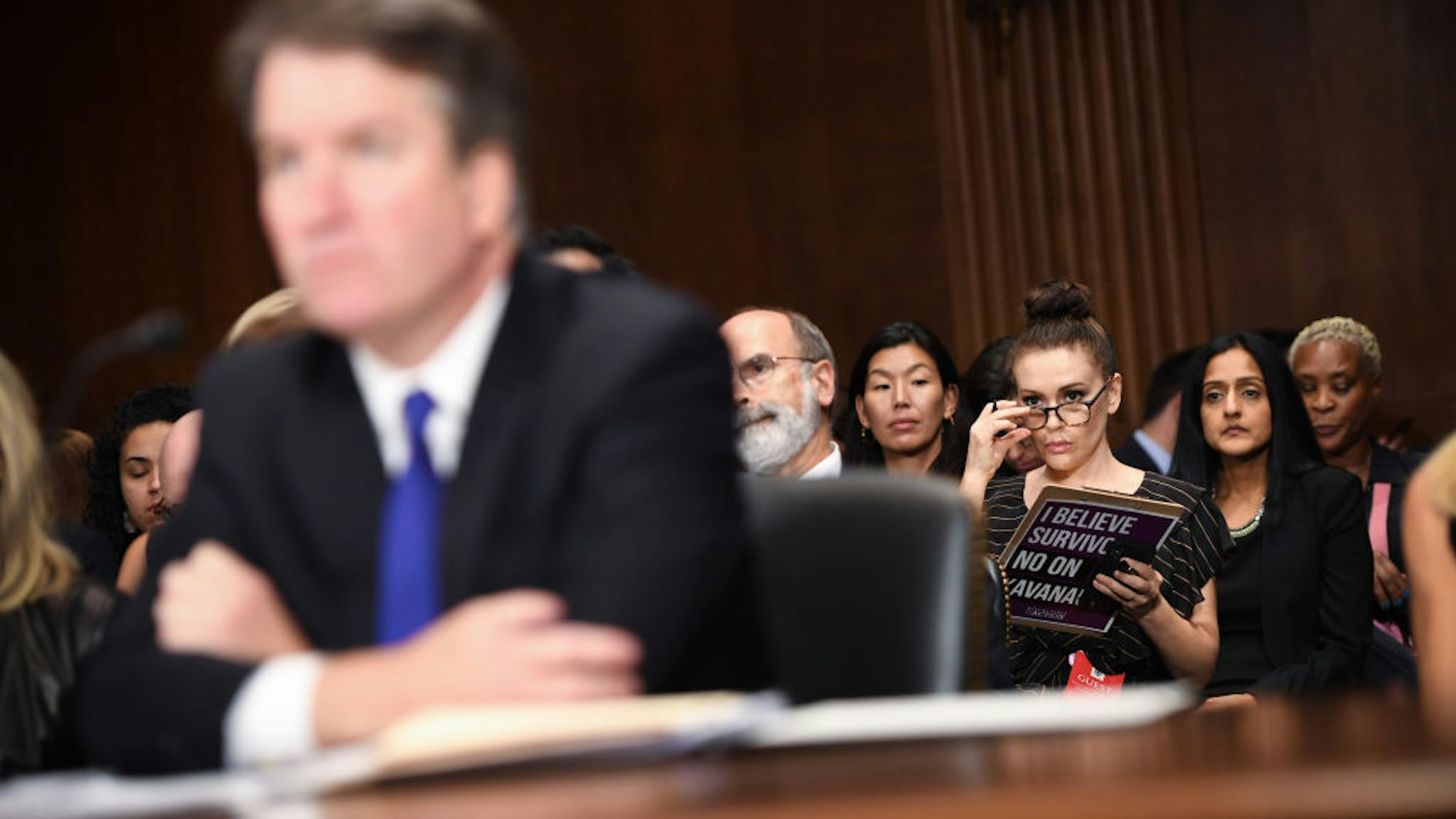 Actress and activist Alyssa Milano (R) listens to Supreme Court nominee Brett Kavanaugh as he testifies before the U.S. Senate Judiciary Committee on Capitol Hill on September 27, 2018 in Washington, DC.