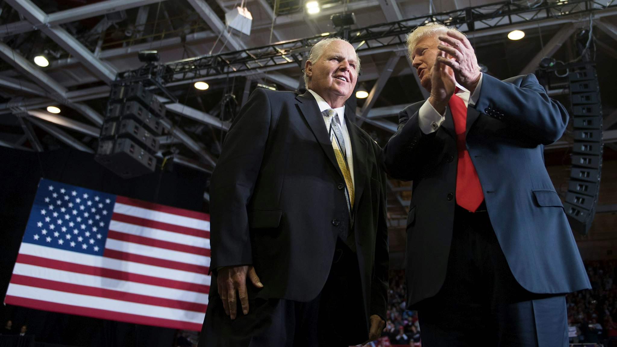 US President Donald Trump alongside radio talk show host Rush Limbaugh arrive at a Make America Great Again rally in Cape Girardeau, Missouri on November 5, 2018. (Photo by Jim WATSON / AFP) (Photo credit should read JIM WATSON/AFP via Getty Images)