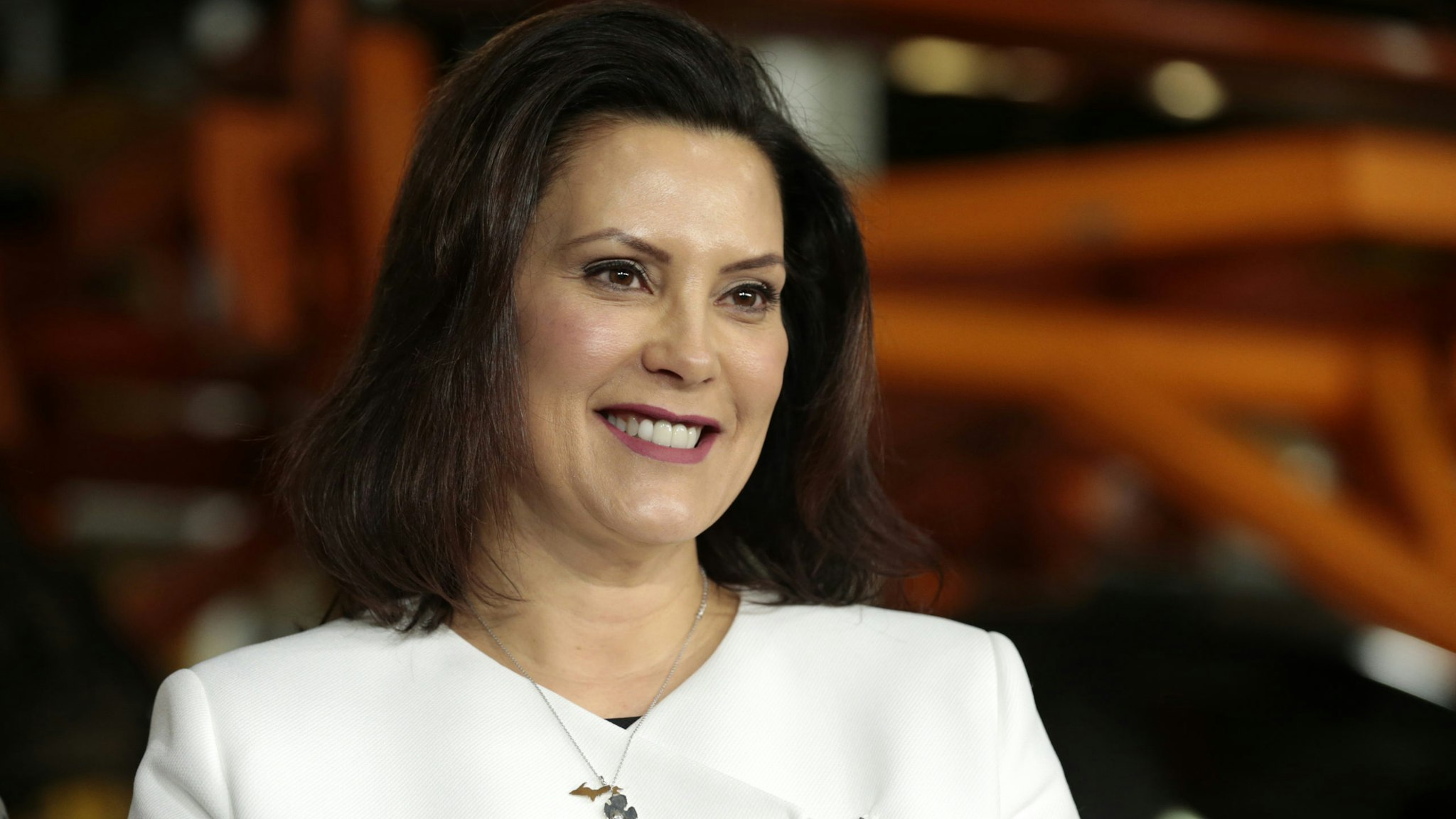 Gretchen Whitmer, governor of Michigan, smiles during an event at the General Motors Co. Orion Assembly plant in Orion Township, Michigan, U.S., on Friday, March 22, 2019. General Motors Co. committed to investing $1.8 billion at plants in six states and to creating 700 new jobs, as the largest U.S. automaker looks to ward off months of criticism by President Donald Trump. Photographer: Jeff Kowalsky/Bloomberg via Getty Images