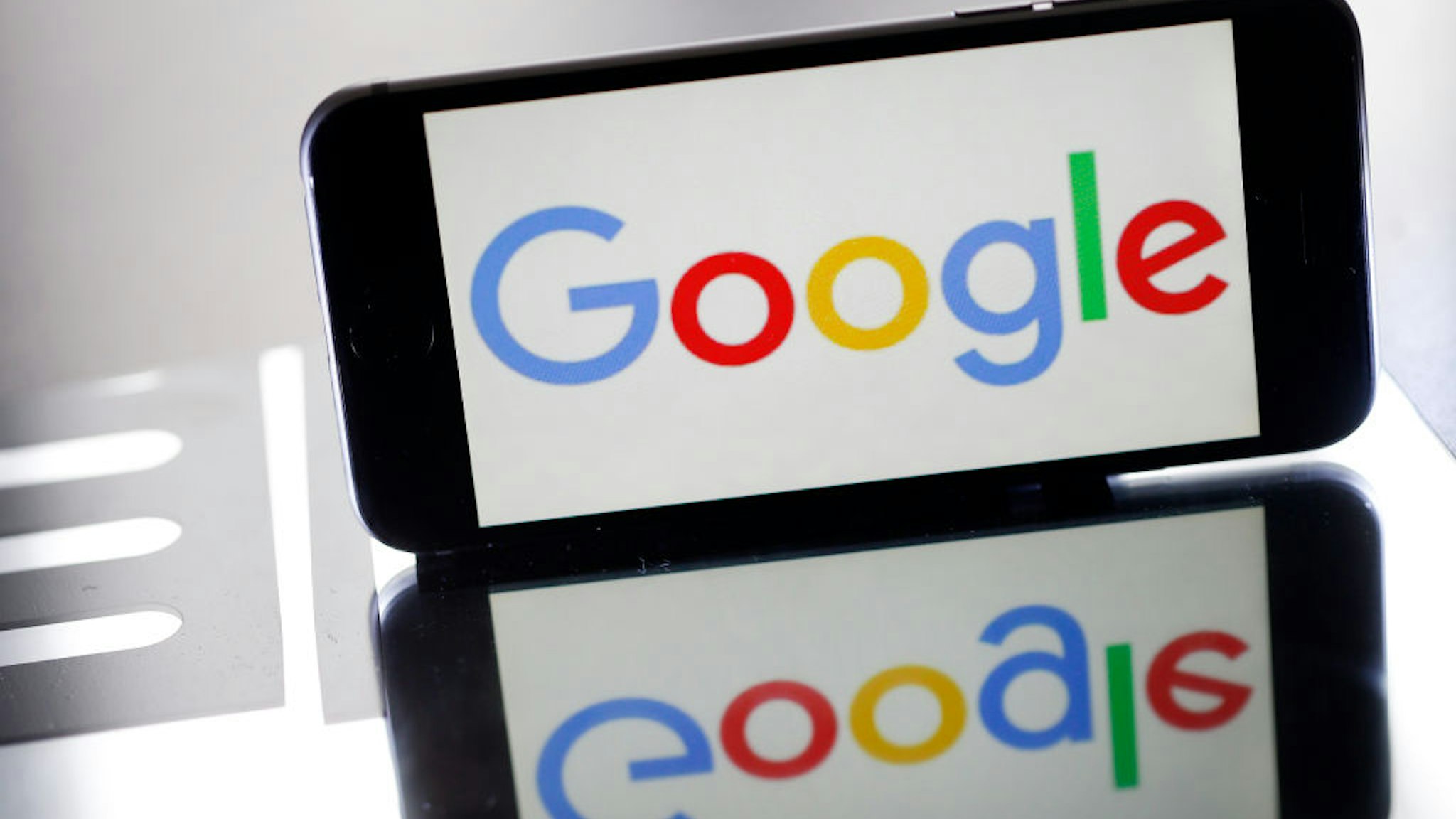 In this photo illustration, the Google logo is displayed on the screen of an iPhone on March 20, 2019 in Paris, France.