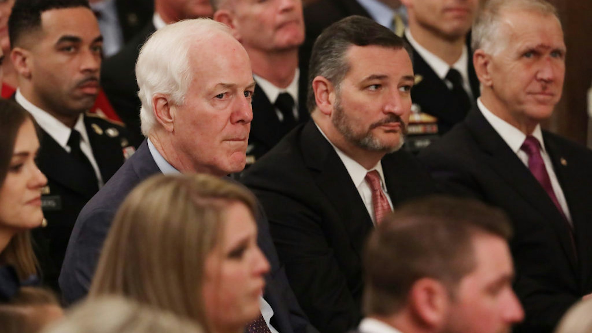Senate Majority Whip John Cornyn (R-TX), Sen. Ted Cruz (R-TX) and Sen. Thom Tillis (R-NC) attend the Medal of Honor ceremony for U.S. Army Master Sgt. Matthew Williams of Boerne, Texas, in the East Room of the White House October 30, 2019 in Washington, DC.