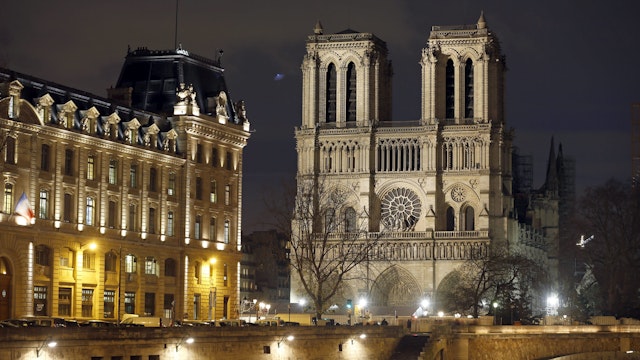 PARIS, FRANCE - DECEMBER 17: The facade of Notre-Dame cathedral is again illuminated at night more than eight months after the fire that ravaged the emblematic monument on December 17, 2019 in Paris, France. A fire broke out in Notre- Dame Cathedral in the evening of Monday, April 15, and quickly spread to the building's wooden roof destroying the famous spire. The cleaning and consolidation phase of the building should continue until the end of the year. (Photo by Chesnot/Getty Images)