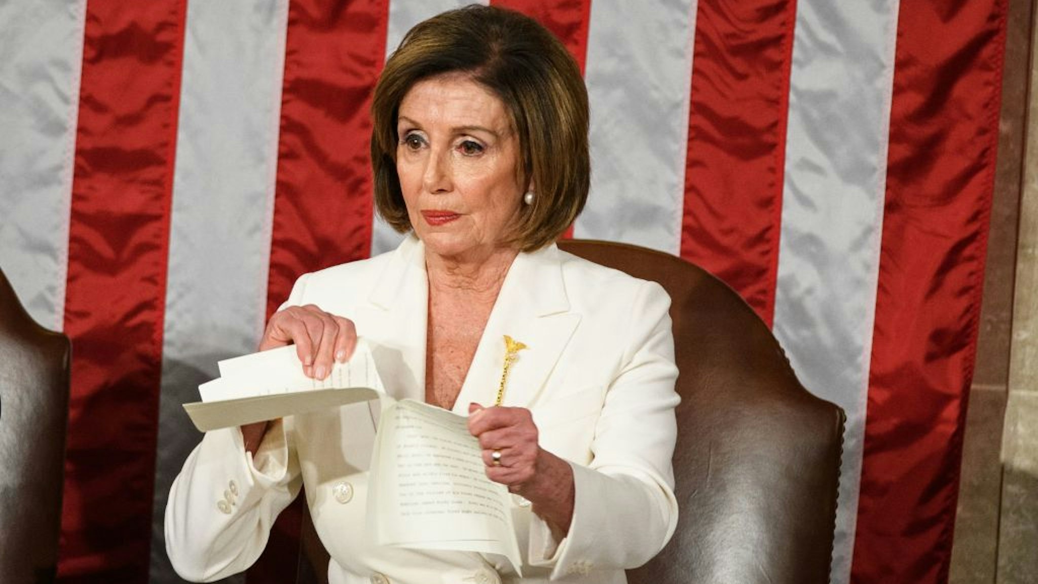 Speaker of the US House of Representatives Nancy Pelosi rips a copy of US President Donald Trumps speech after he delivers the State of the Union address at the US Capitol in Washington, DC, on February 4, 2020.