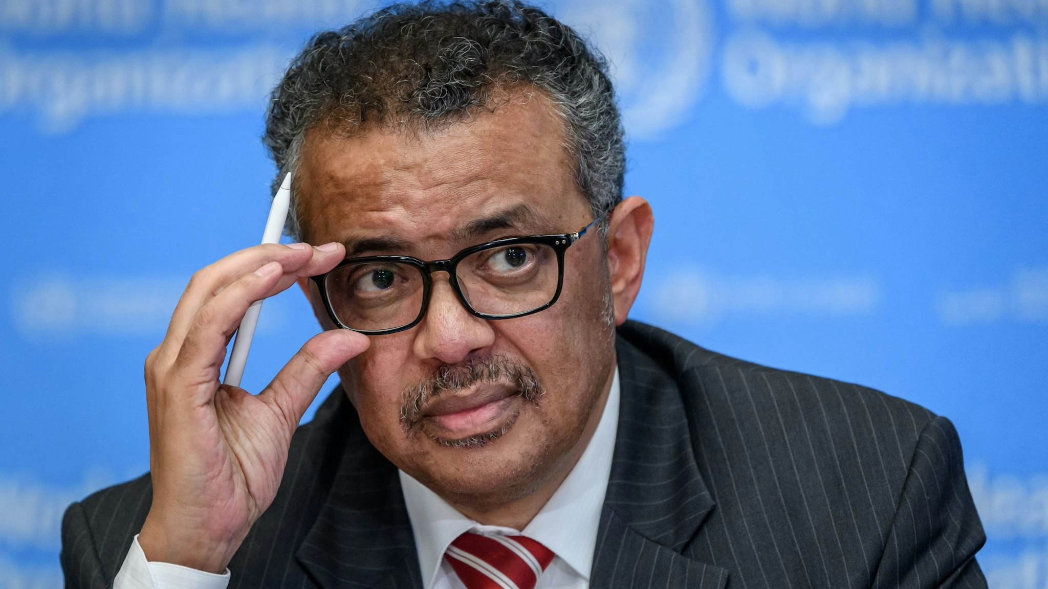 World Health Organization (WHO) Director-General Tedros Adhanom Ghebreyesus attends a daily press briefing on COVID-19, the disease caused by the novel coronavirus, at the WHO heardquaters in Geneva on March 11, 2020. - WHO Director-General Tedros Adhanom Ghebreyesus announced on March 11, 2020, that the new coronavirus outbreak can now be characterised as a pandemic. (Photo by Fabrice COFFRINI / AFP) (Photo by FABRICE COFFRINI/AFP via Getty Images)