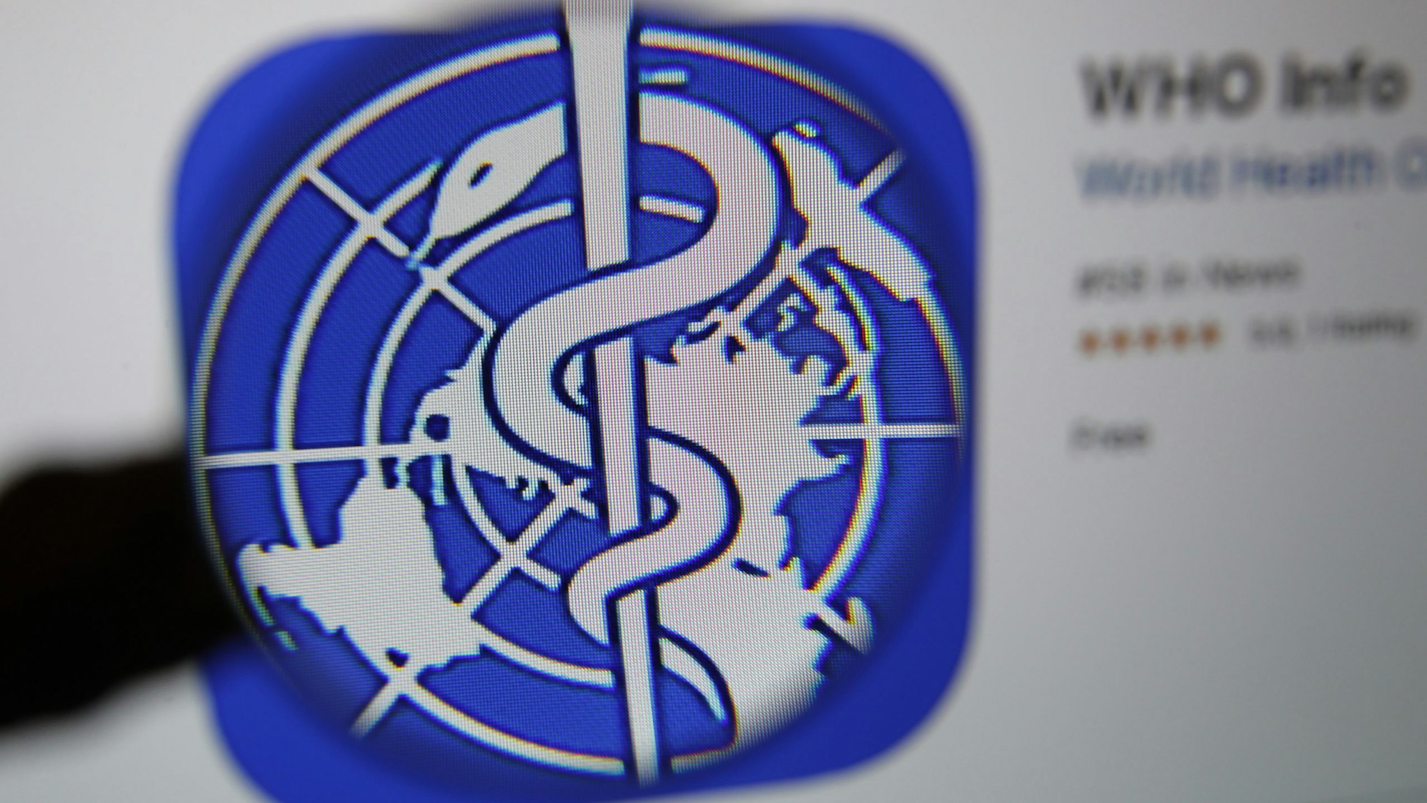 The logo for the World Health Organization (WHO) WHO Info application is displayed on a computer screen in an arranged photograph taken in Bern, Switzerland, on Tuesday, March 31, 2020. The Covid-19 pandemic has triggered a seismic wave of health awareness and anxiety, which is energizing a new category of virus-fighting tech and apps. Photographer: Stefan Wermuth/Bloomberg via Getty Images