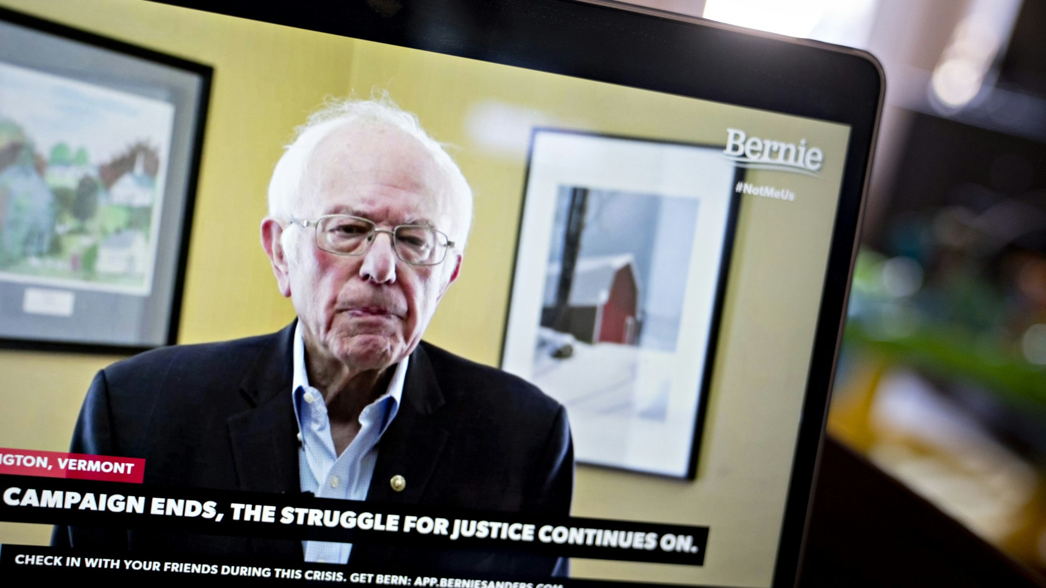 Senator Bernie Sanders, an Independent from Vermont and former 2020 presidential candidate, pauses while speaking during a livestream event on a laptop computer in this arranged photograph in Arlington, Virginia, U.S., on Wednesday, April 8, 2020. Sanders ended his presidential run today after an unbroken string of losses in recent weeks that cemented Joe Biden's all-but insurmountable lead in delegates. Photographer: Andrew Harrer/Bloomberg via Getty Images