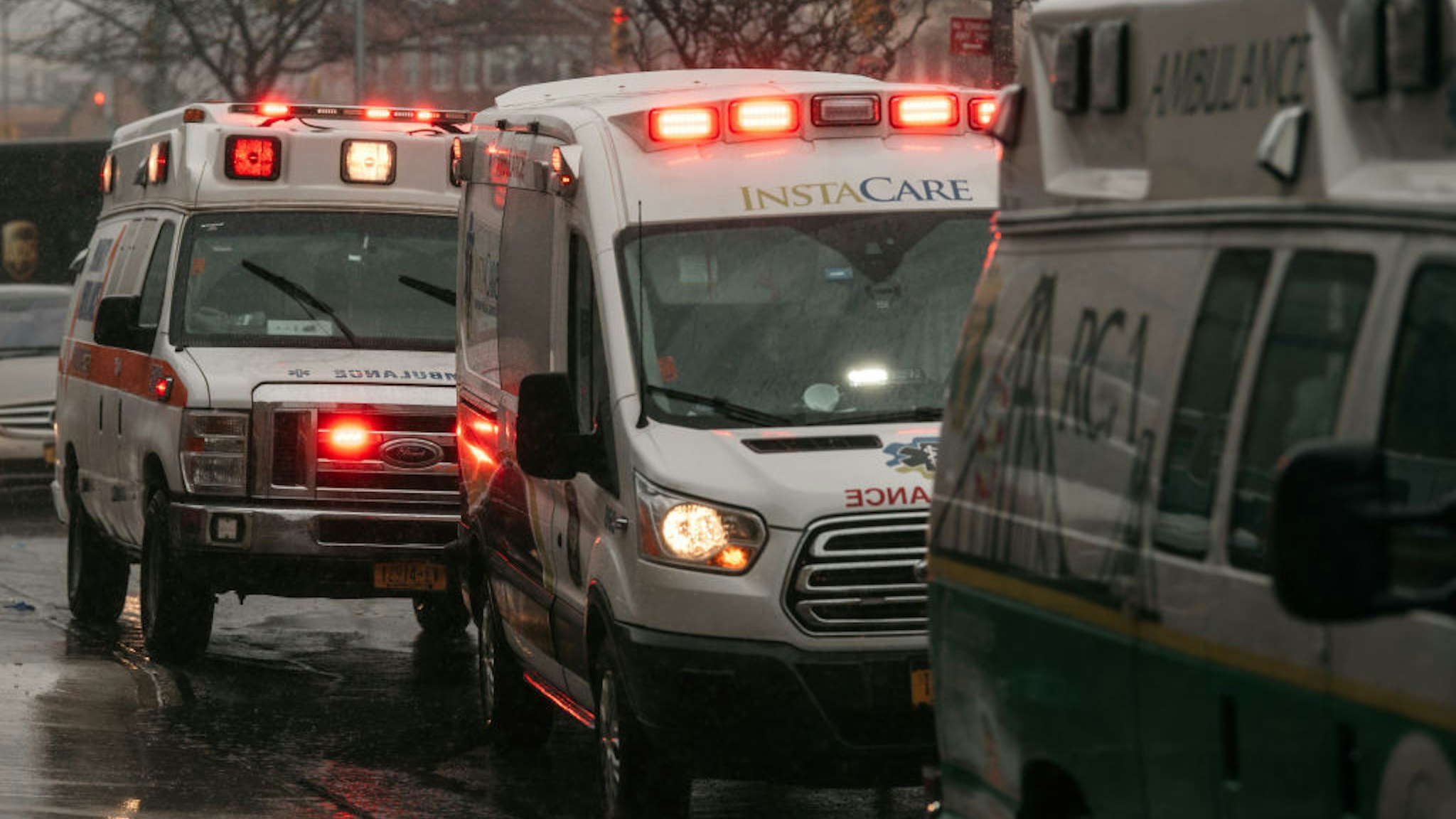 Parked ambulances continue to flash their lights near Brookdale Hospital Medical Center in Brooklyn on April 13, 2020 in New York City.