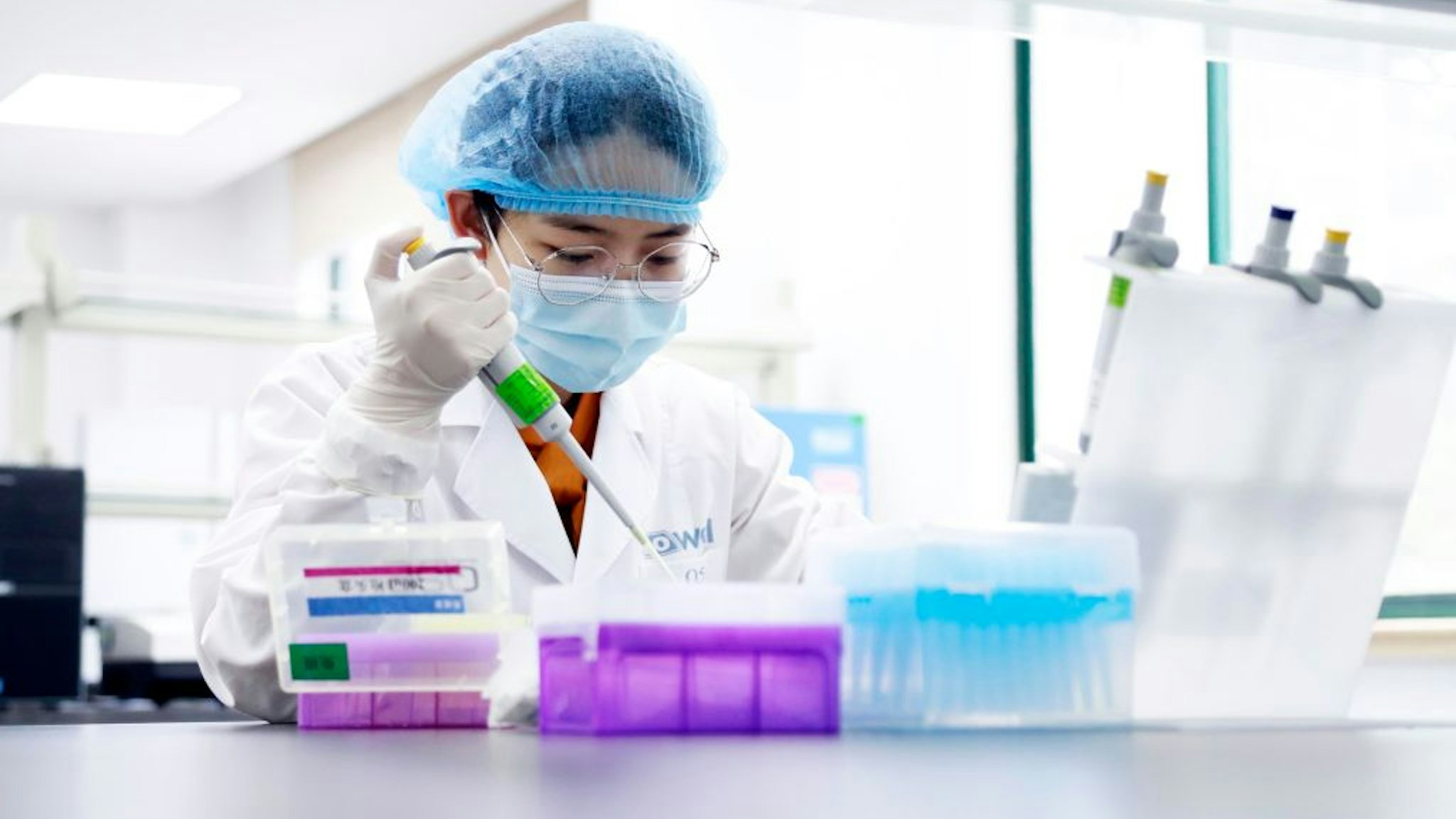 A researcher tests an antibody at Dowell Clinical Laboratory on March 1, 2020 in Shanghai, China.