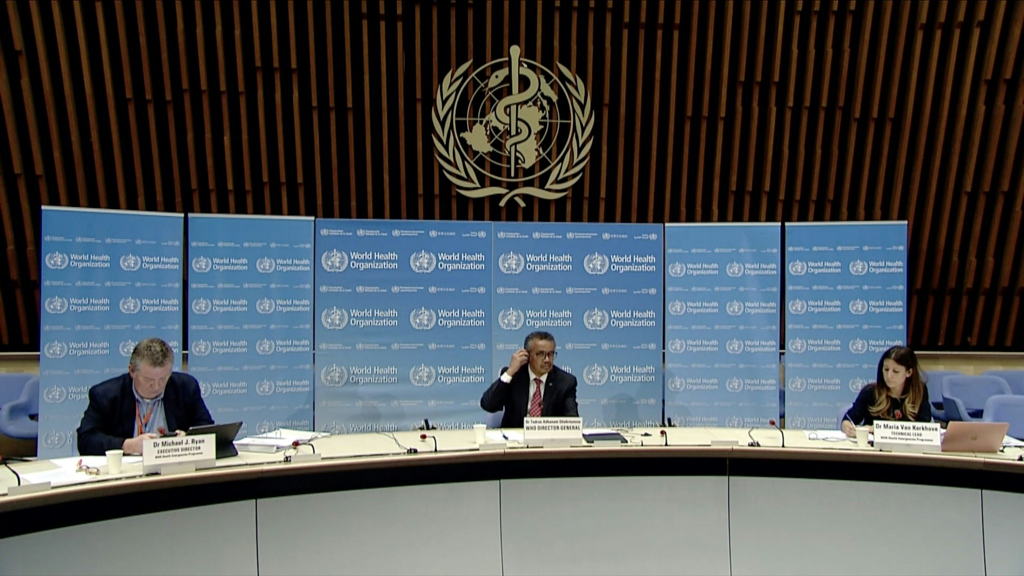 A TV grab from the World Health Organization (WHO) website shows (From L) World Health Organization (WHO) Health Emergencies Programme Director Michael Ryan, WHO Director-General Tedros Adhanom Ghebreyesus and WHO Technical Lead Maria Van Kerkhove attending a WHO virtual news briefing on the COVID-19 (novel coronavirus) from the WHO headquarters, on April 17, 2020 in Geneva. - Lady Gaga will launch a giant online coronavirus awareness concert on April 18 entitled "One World: Together at Home", featuring music icons like Paul McCartney and Stevie Wonder. (Photo by - / AFP) (Photo by -/AFP via Getty Images)