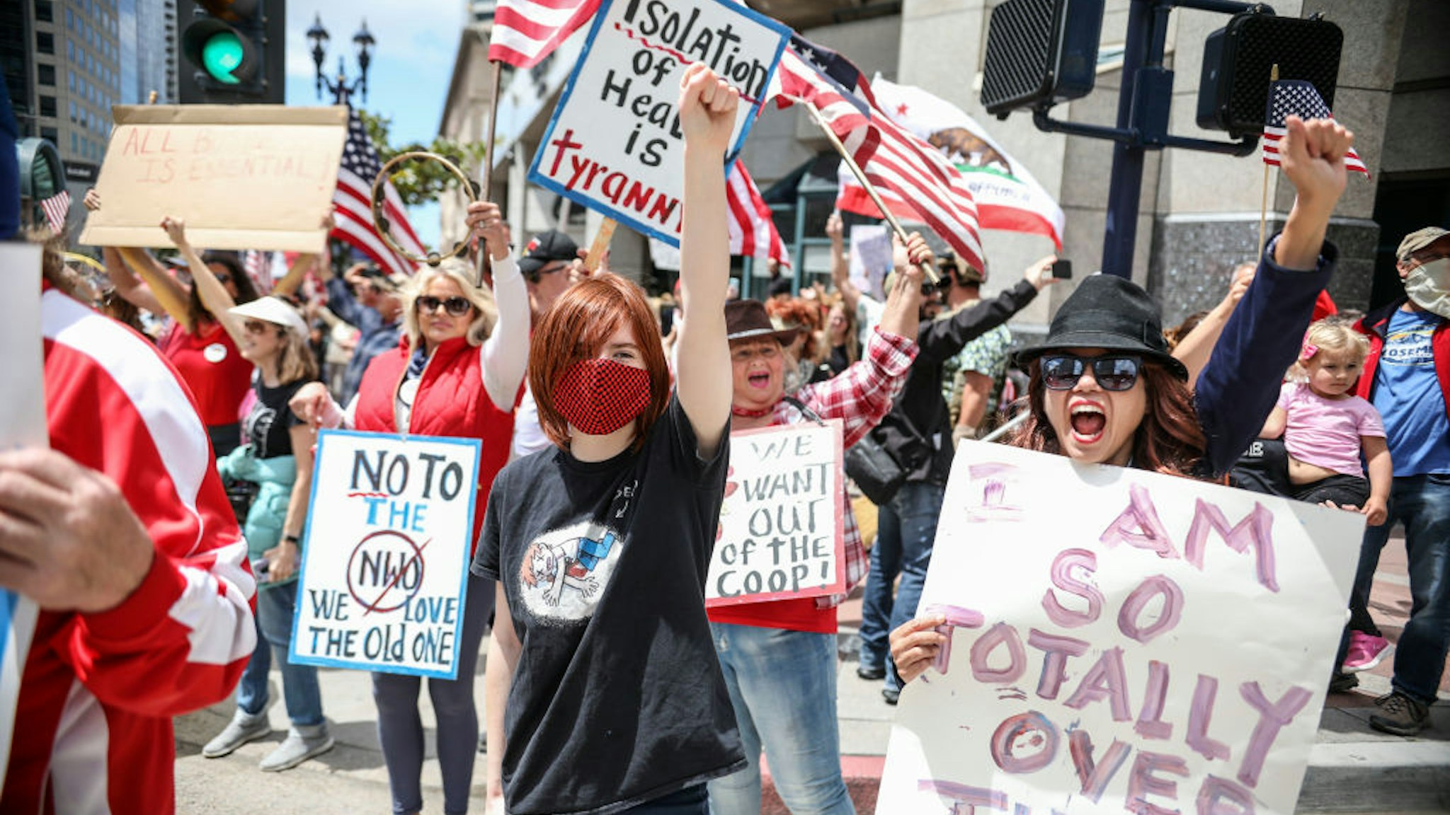 Demonstrators protest during a "Freedom Rally" against Stay-At-Home Directives on April 18, 2020 in San Diego, California.