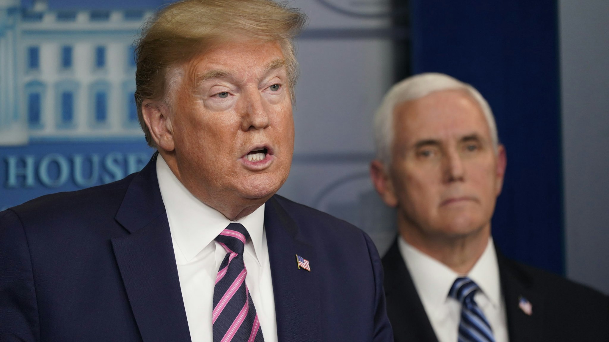 U.S. President Donald Trump speaks as Vice President Mike Pence listens during a news conference in the White House in Washington, D.C., U.S., on Friday, April 24, 2020. Trump has been determined to talk his way through the coronavirus crisis, but his frequent misstatements at his daily news conferences have caused a litany of public health and political headaches for the White House. Photographer: Chris Kleponis/Polaris/Bloomberg via Getty Images