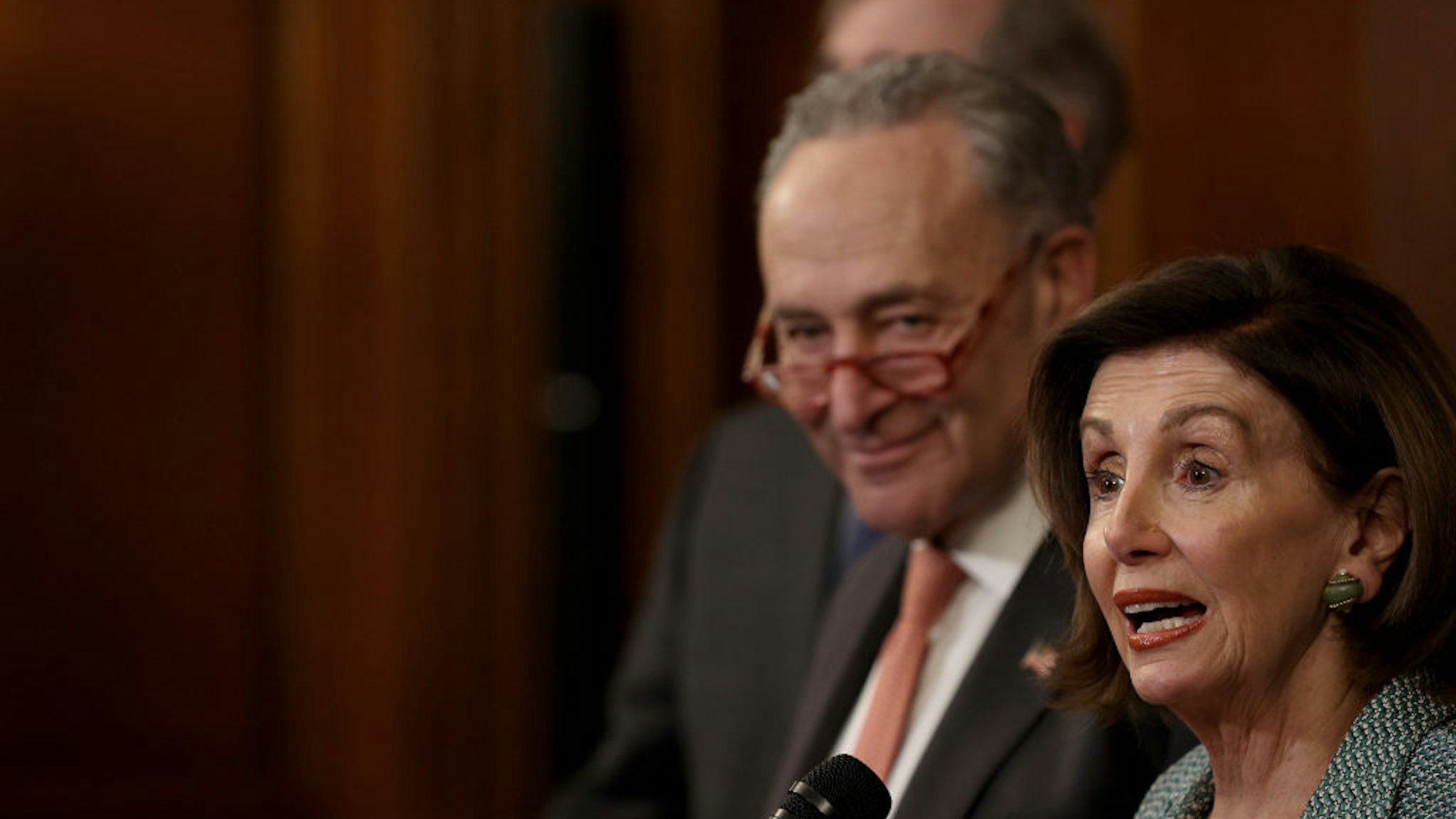 U.S. Speaker of the House Nancy Pelosi (R) (D-CA) and Senate Minority Leader Chuck Schumer (L) (D-NY) speak at a press conference marking the one year anniversary of the House passing HR-1, the For The People Act, March 10, 2020 in Washington, DC
