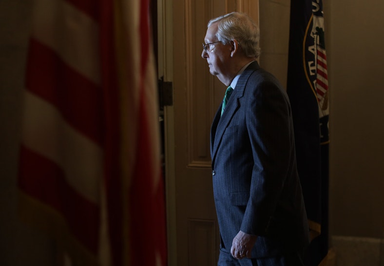 WASHINGTON, DC - MARCH 19: U.S. Senate Majority Leader Sen. Mitch McConnell (R-KY) walks into his office after he spoke on the Senate floor at the U.S. Capitol March 19, 2020 on Capitol Hill in Washington, DC. The Senate is back in session today as GOPs and Democrats work behind the scenes to produce “phase three” of the coronavirus response bill to combat the outbreak of the COVID-19 pandemic. (Photo by Alex Wong/Getty Images)