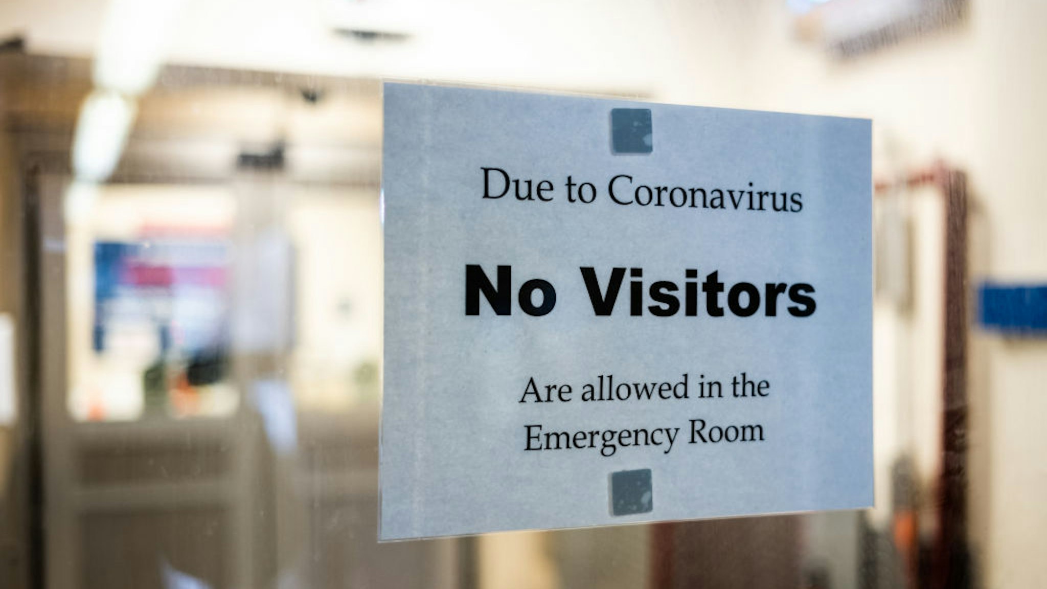 A sign is posted on the door of the Emergency Department at St. Barnabas Hospital on March 23, 2020 in the Bronx borough of New York City.
