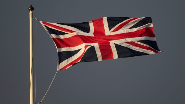 A Union Jack flag flying against a dark sky on March 08, 2020 in Cardiff, United Kingdom.