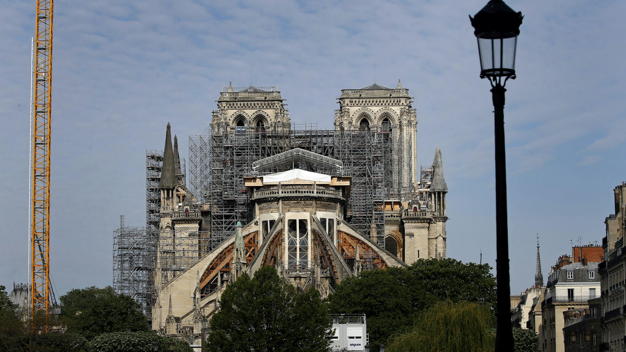 PARIS, FRANCE - APRIL 27: Notre-Dame de Paris Cathedral is seen one year after fire ravaged the emblematic monument on April 27, 2020 in Paris, France. Restoration work resumes slowly after an interruption due to the coronavirus lockdown. The coronavirus (COVID-19) pandemic has spread to many countries across the world, claiming over 206,000 lives and infecting over 2.9 million people. (Photo by Chesnot/Getty Images)
