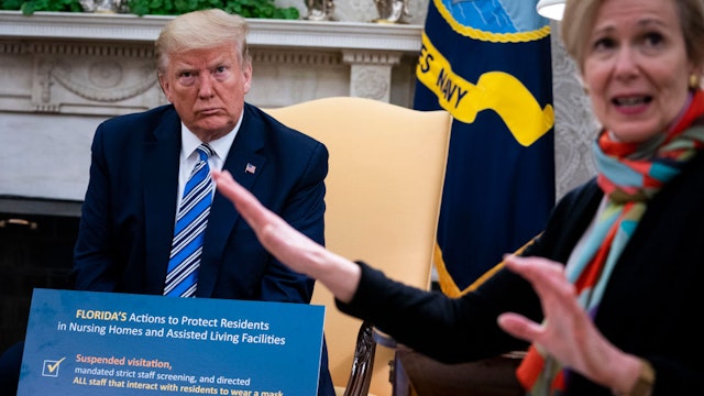 White House Coronavirus Task Force Coordinator Deborah Birx (R) answers a question while meeting with Florida Gov. Ron DeSantis and U.S. President Donald Trump in the Oval Office of the White House on April 28, 2020 in Washington, DC.