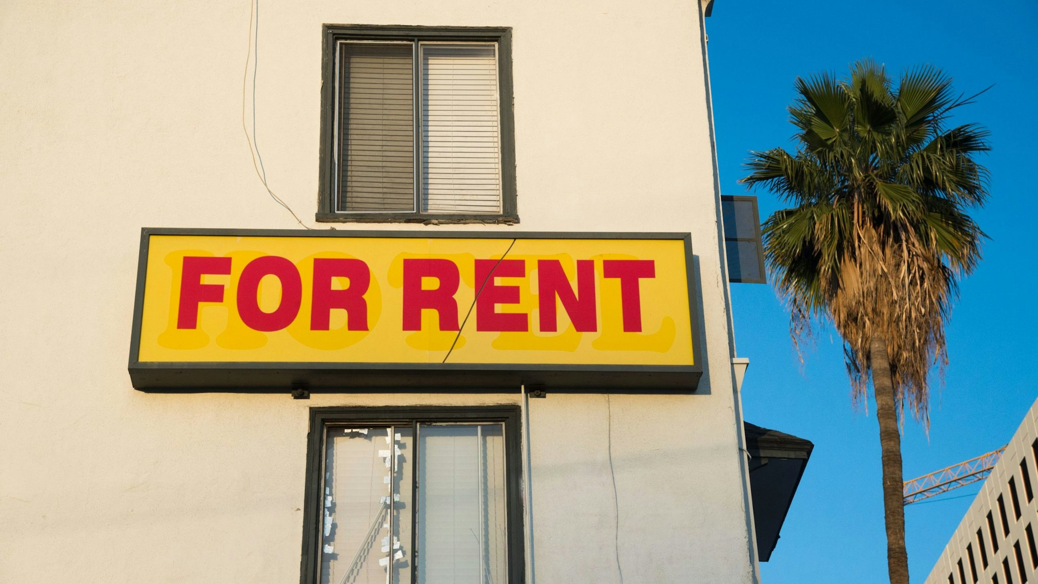 A "For Rent" sign is seen on a building Hollywood, California, May 11, 2016. Angelinos are feeling the increasing burden of rising rents and threats of eviction as forecast indicate rent prices will continue to rise through 2018. / AFP / ROBYN BECK (Photo credit should read ROBYN BECK/AFP via Getty Images)