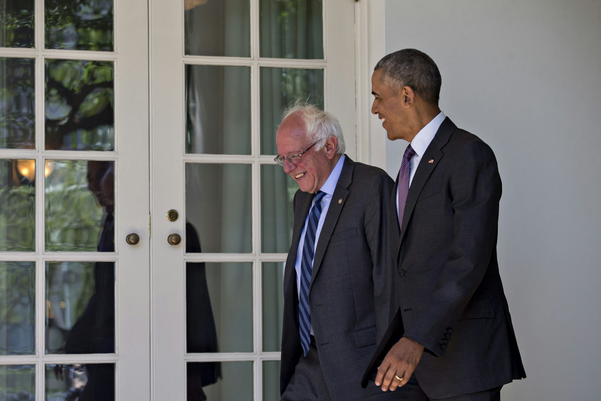 U.S. President Barack Obama, right, and Senator Bernie Sanders, an independent from Vermont and 2016 Democratic presidential candidate, walk to the Oval Office of the White House in Washington, D.C., U.S., on Thursday, June 9, 2016. Obama said yesterday he expects Democrats to unify soon behind their presumptive presidential nominee, Hillary Clinton, and that her divisive primary contest with Sanders was healthy for the party. Photographer: Andrew Harrer/Bloomberg via Getty Images