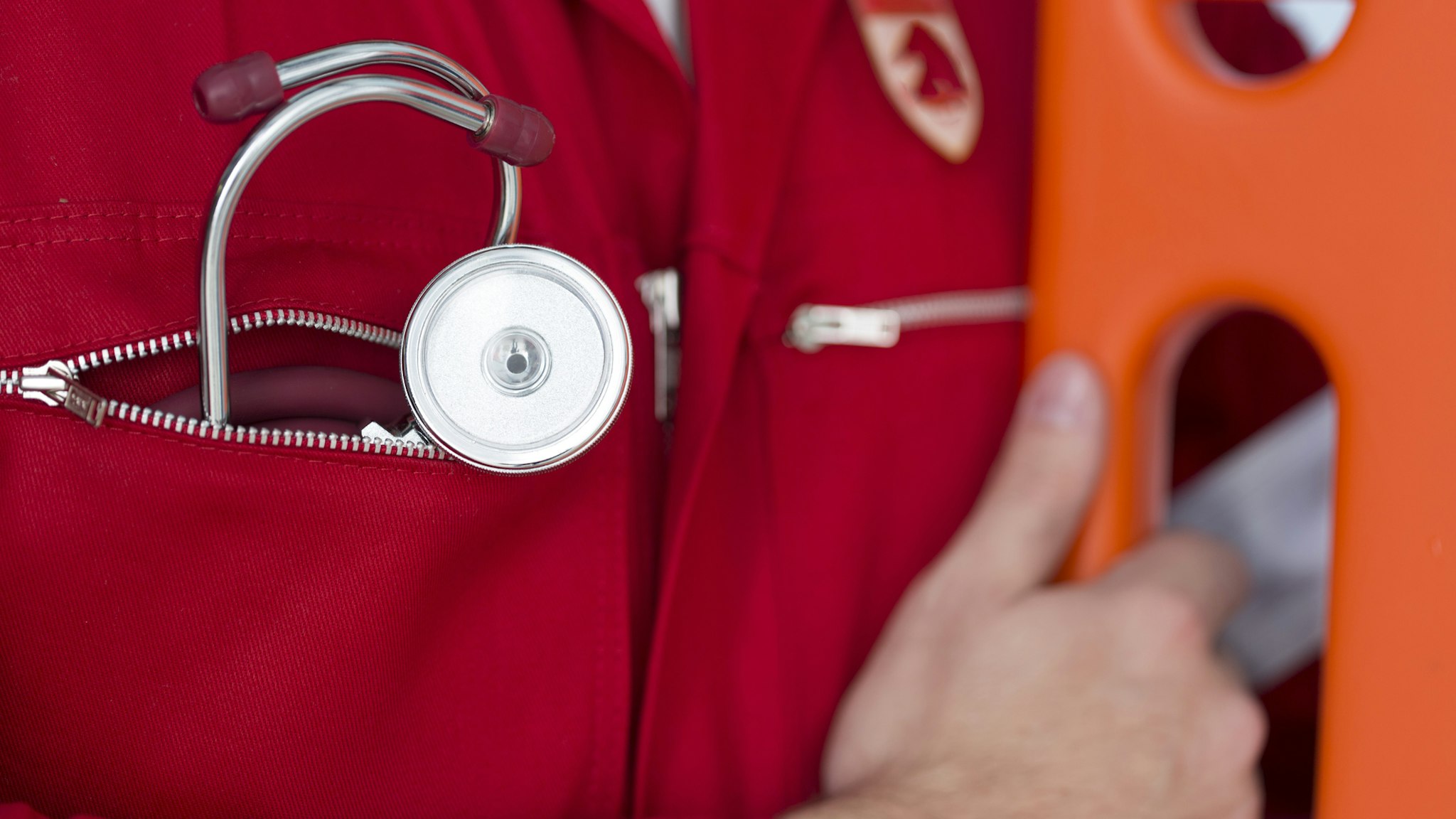 Close-up of paramedic with stethoscope - stock photo