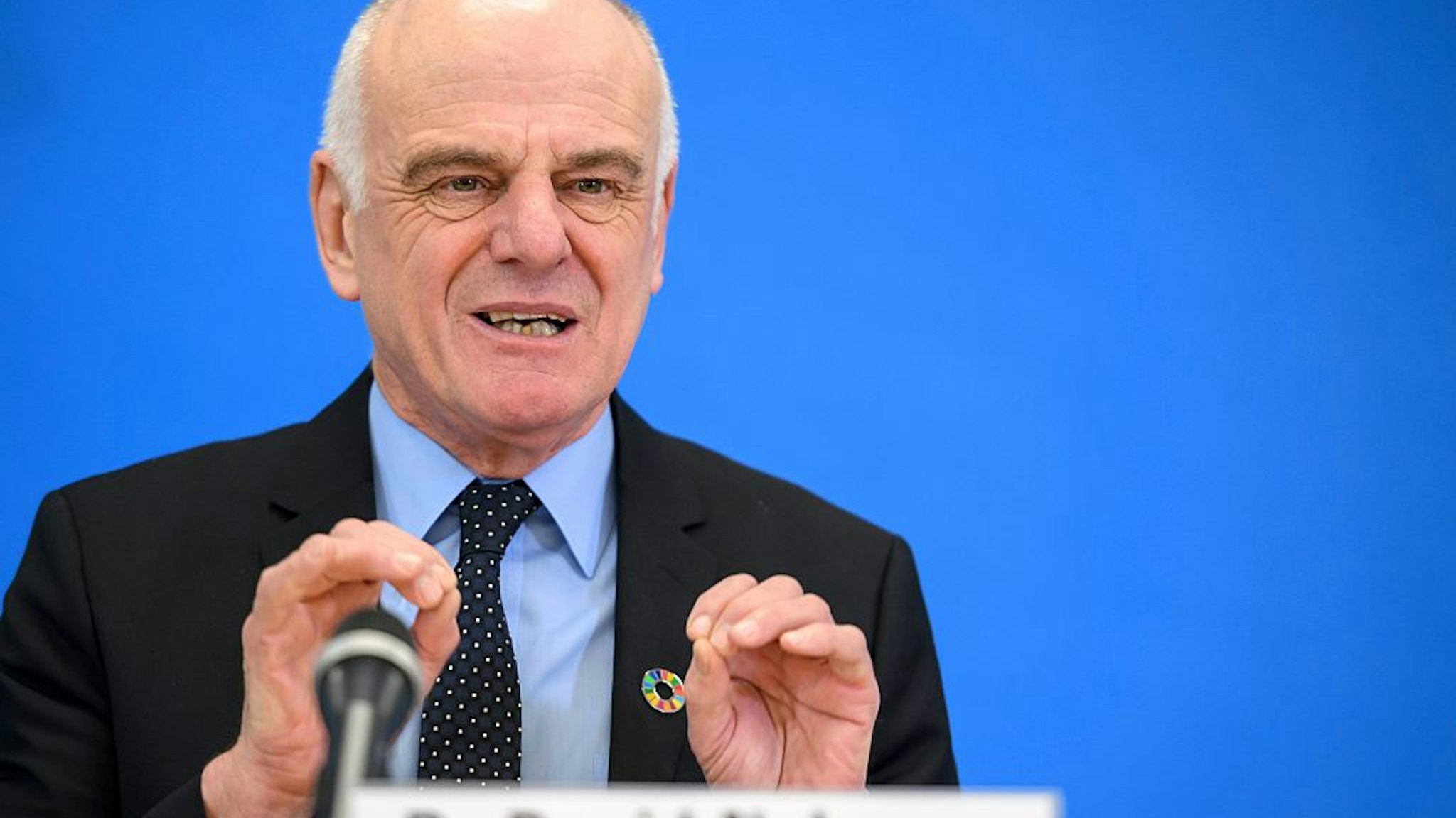 Candidate to the post of Director-General of the World Health Organization (WHO) David Nabarro gestures during a press conference on January 26, 2017 in Geneva.