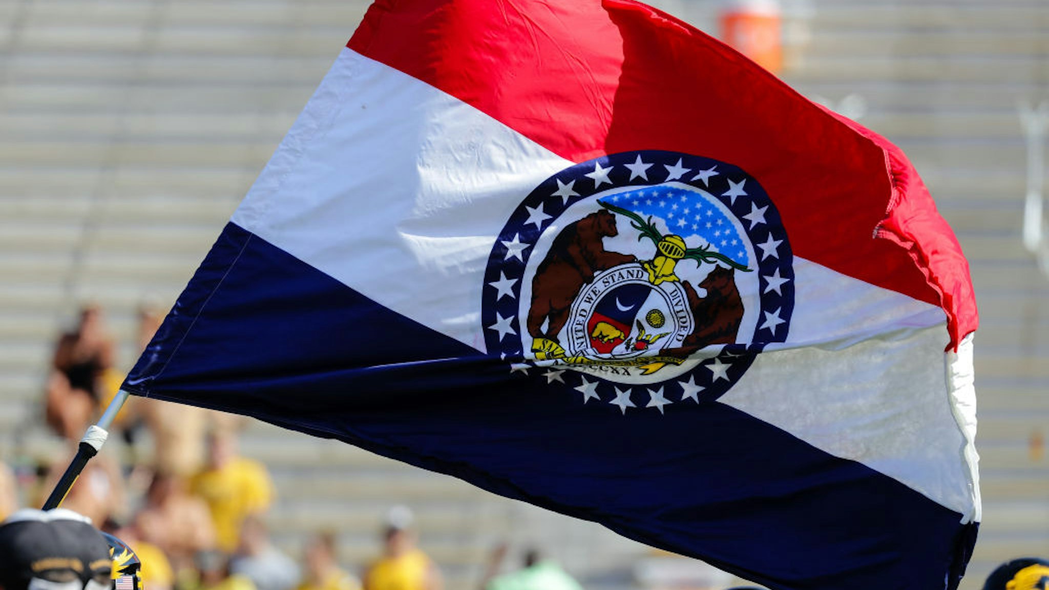 The State Flag of Missouri leads the Missouri Tigers' onto the field prior to the start of the first half of the Purdue Boilermakers game at the Missouri Tigers on September 16, 2017, at Memorial Stadium on Faurot Field in Columbia, MO.