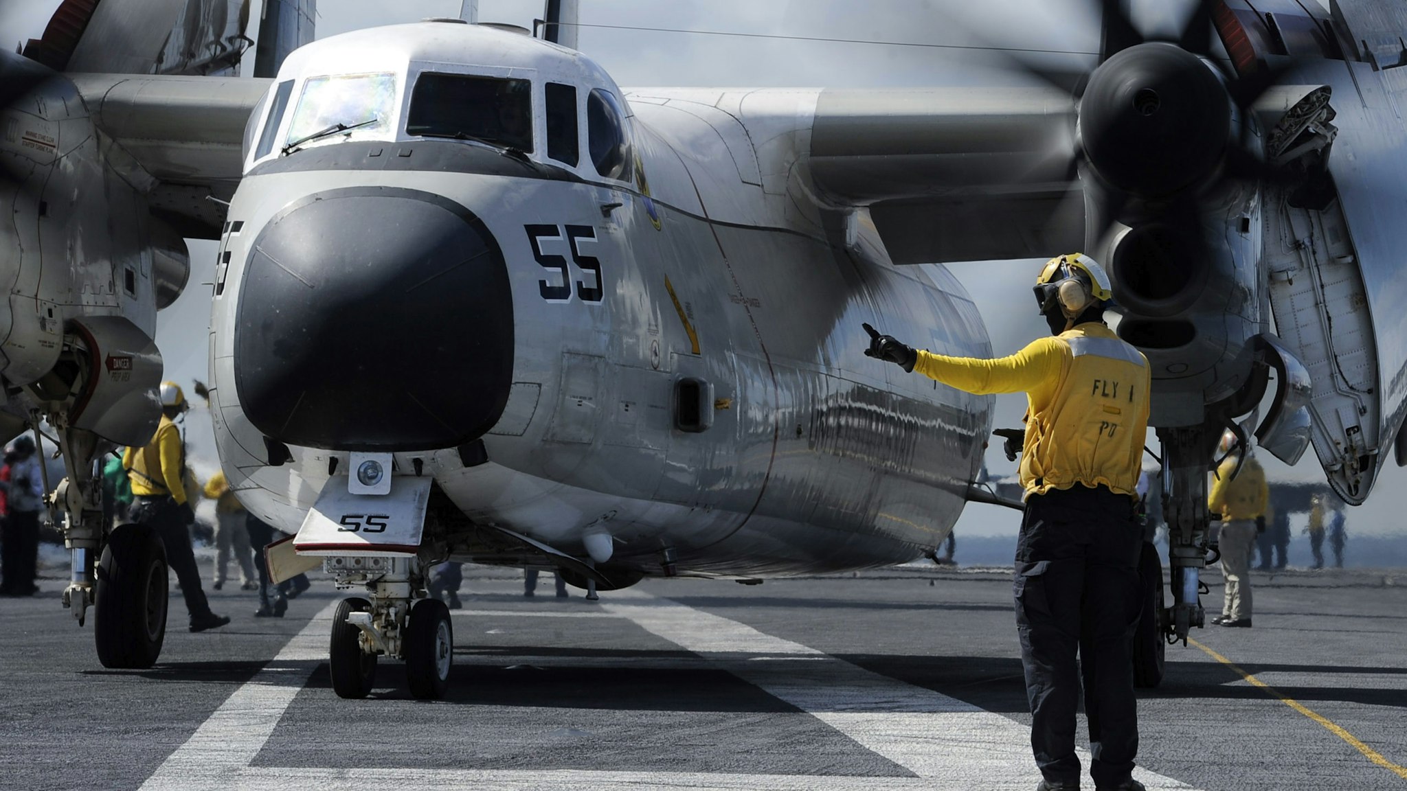 TLANTIC OCEAN, OCTOBER 20: In this U.S. Navy handout, aviation Boatswain's Mate (Handling) 1st Class Michael Osborne directs a C-2A Greyhound, assigned to the "Rawhides" of Fleet Logistics Support Squadron (VRC) 40, on the flight deck aboard USS Harry S. Truman (CVN 75) on October 20, 2017 in the Atlantic Ocean. Truman is currently underway conducting Tailored Shipboard Test Availability and Final Evaluation Problem (TSTA/FEP) in preparation for future operations. (Photo by Mass Communication Specialist 2nd Class Anthony Flynn/U.S. Navy via Getty Images)TLANTIC OCEAN, OCTOBER 20: In this U.S. Navy handout, aviation Boatswain's Mate (Handling) 1st Class Michael Osborne directs a C-2A Greyhound, assigned to the "Rawhides" of Fleet Logistics Support Squadron (VRC) 40, on the flight deck aboard USS Harry S. Truman (CVN 75) on October 20, 2017 in the Atlantic Ocean. Truman is currently underway conducting Tailored Shipboard Test Availability and Final Evaluation Problem (TSTA/FEP) in preparation for future operations. (Photo by Mass Communication Specialist 2nd Class Anthony Flynn/U.S. Navy via Getty Images)