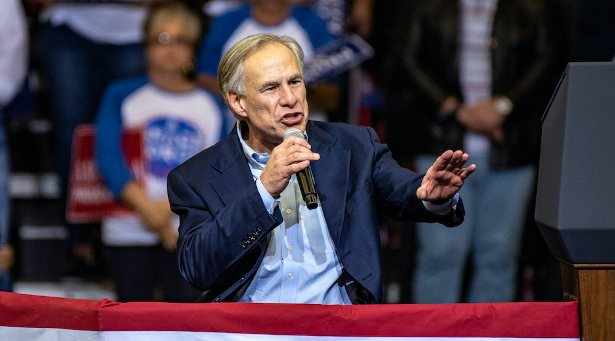 Greg Abbott, governor of Texas, speaks during a campaign rally with U.S. President Donald Trump for Senator Ted Cruz, not pictured, in Houston, Texas, U.S., on Monday, Oct. 22, 2018. Trump declared that he's a "nationalist" at the rally as he appealed to Texas Republicans to re-elect Cruz and help the party keep control of Congress. Photographer: Sergio Flores/Bloomberg