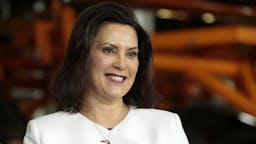 General Motors Co. Makes Announcement Amid Feud With Trump Gretchen Whitmer, governor of Michigan, smiles during an event at the General Motors Co. Orion Assembly plant in Orion Township, Michigan, U.S., on Friday, March 22, 2019. General Motors Co. committed to investing $1.8 billion at plants in six states and to creating 700 new jobs, as the largest U.S. automaker looks to ward off months of criticism by President Donald Trump.